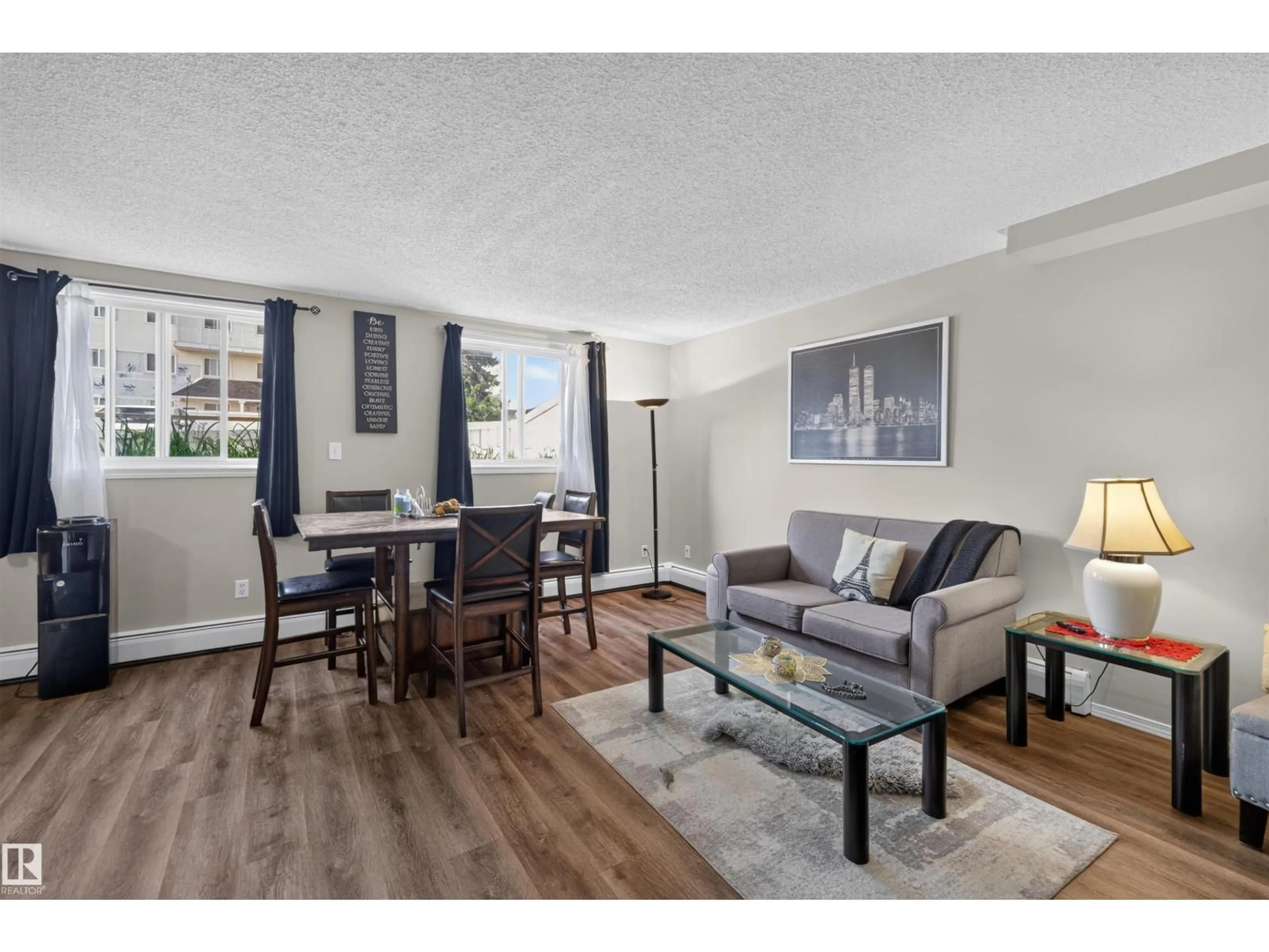Living room with furniture, wood/laminate floor for #102 - 14520 52 ST, Edmonton Alberta T5A3K5