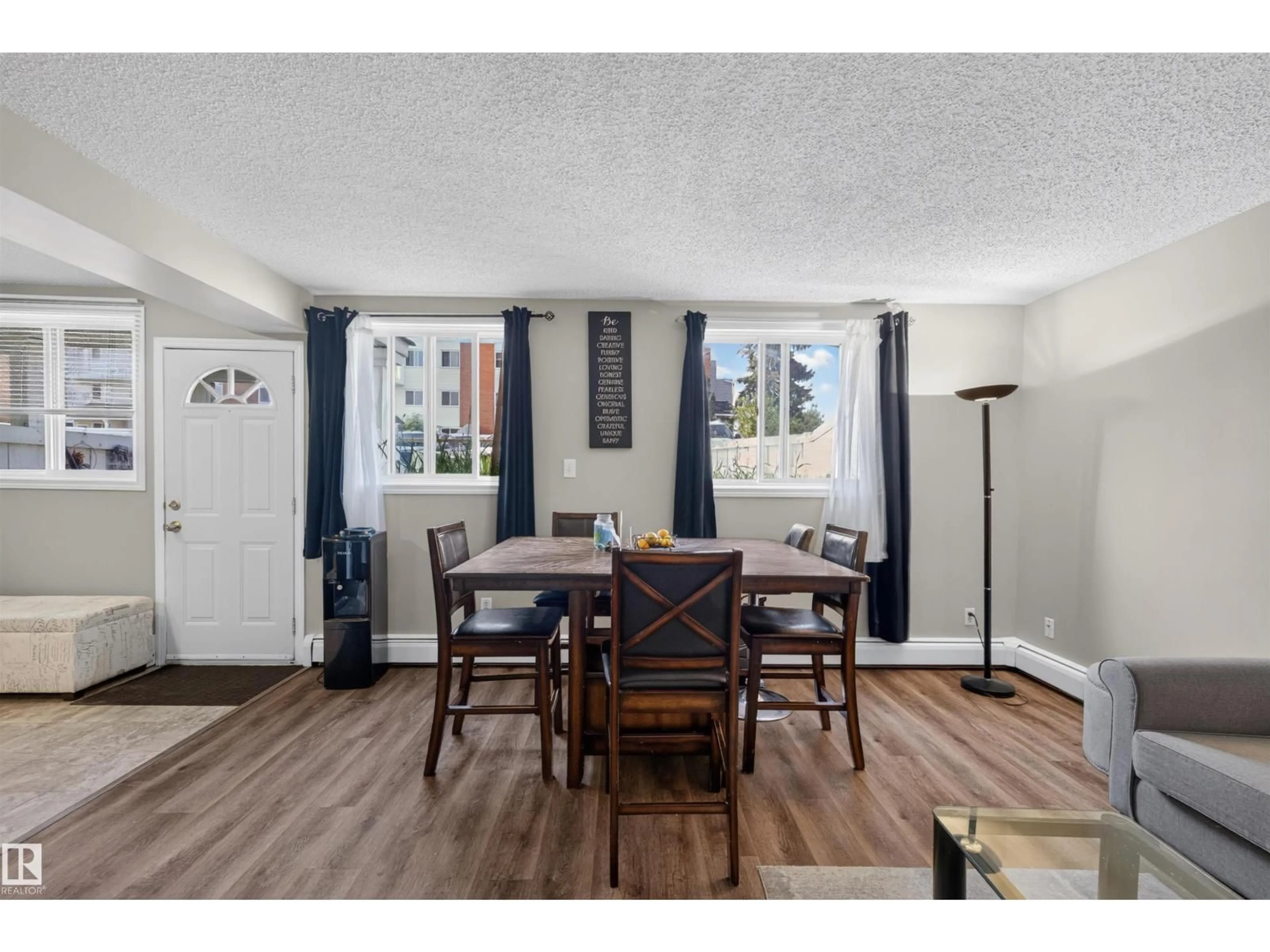 Dining room, wood/laminate floor for #102 - 14520 52 ST, Edmonton Alberta T5A3K5