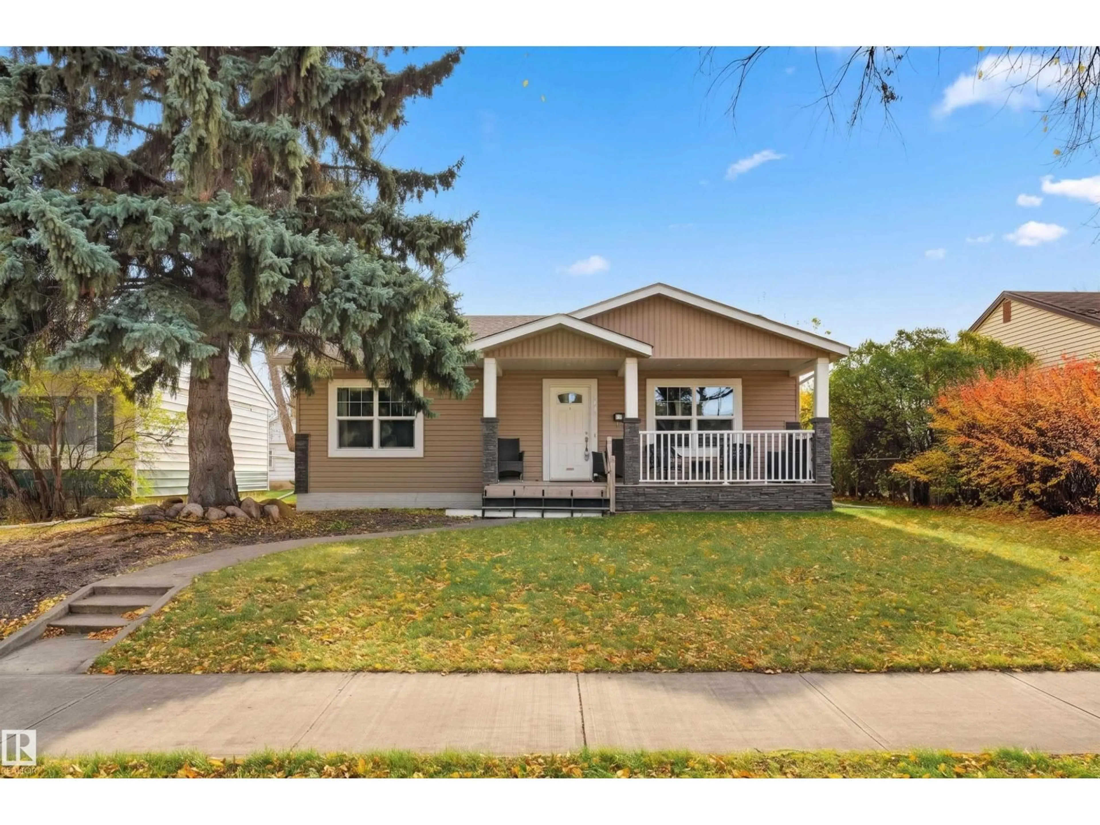 Home with vinyl exterior material, street for 13919 119 AV, Edmonton Alberta T5L2N7