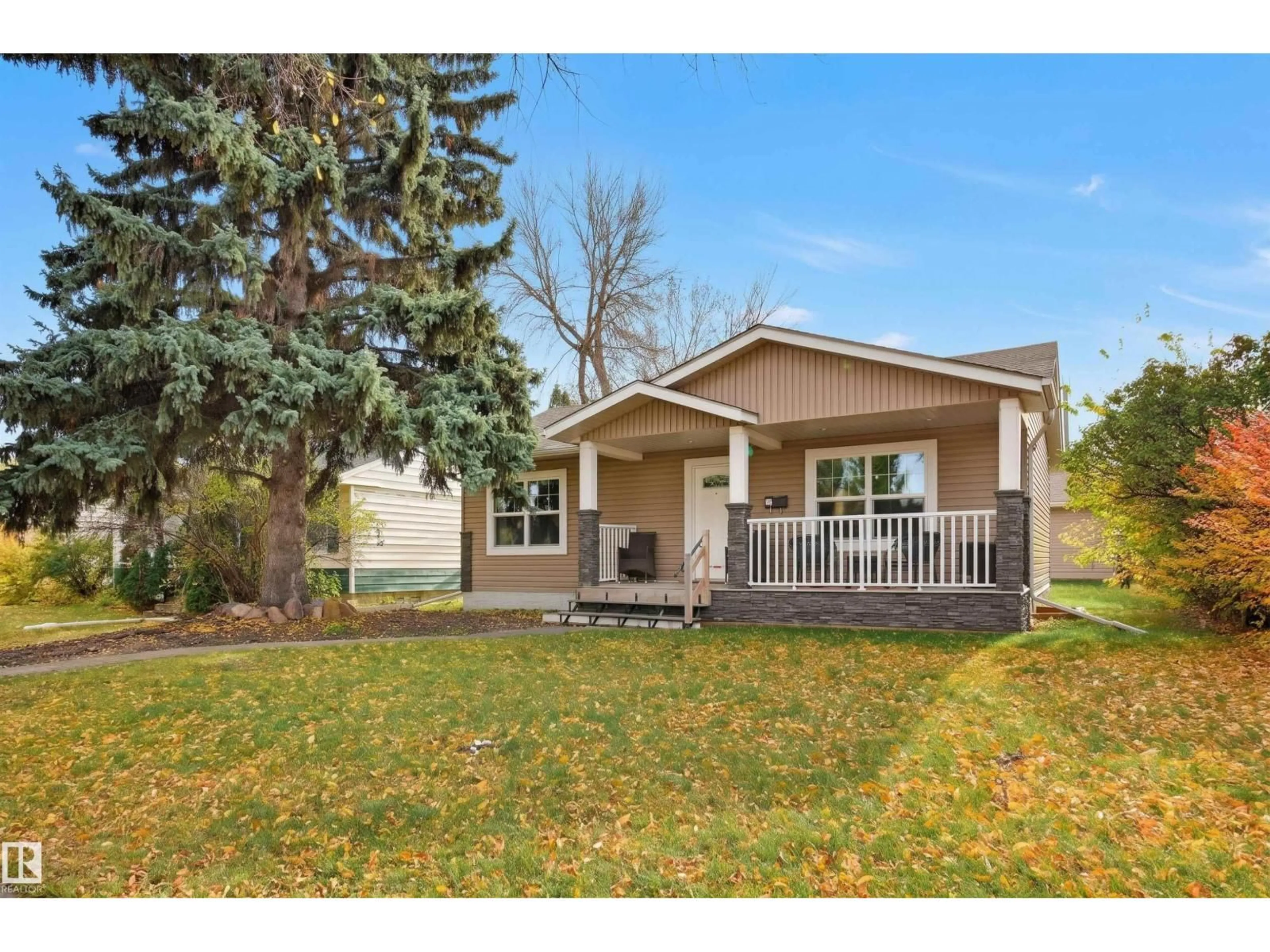 Home with vinyl exterior material, street for 13919 119 AV, Edmonton Alberta T5L2N7