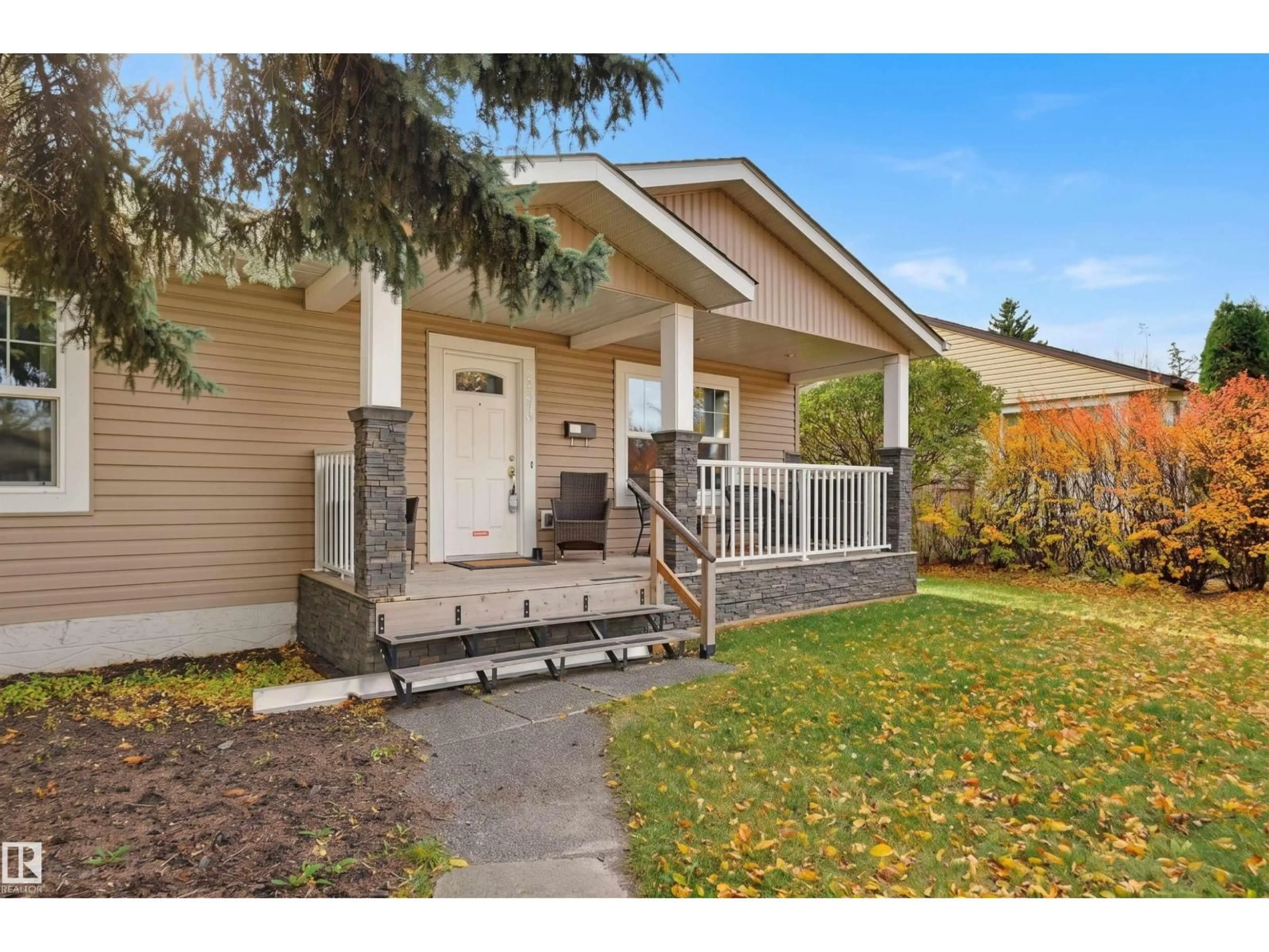 Home with vinyl exterior material, street for 13919 119 AV, Edmonton Alberta T5L2N7