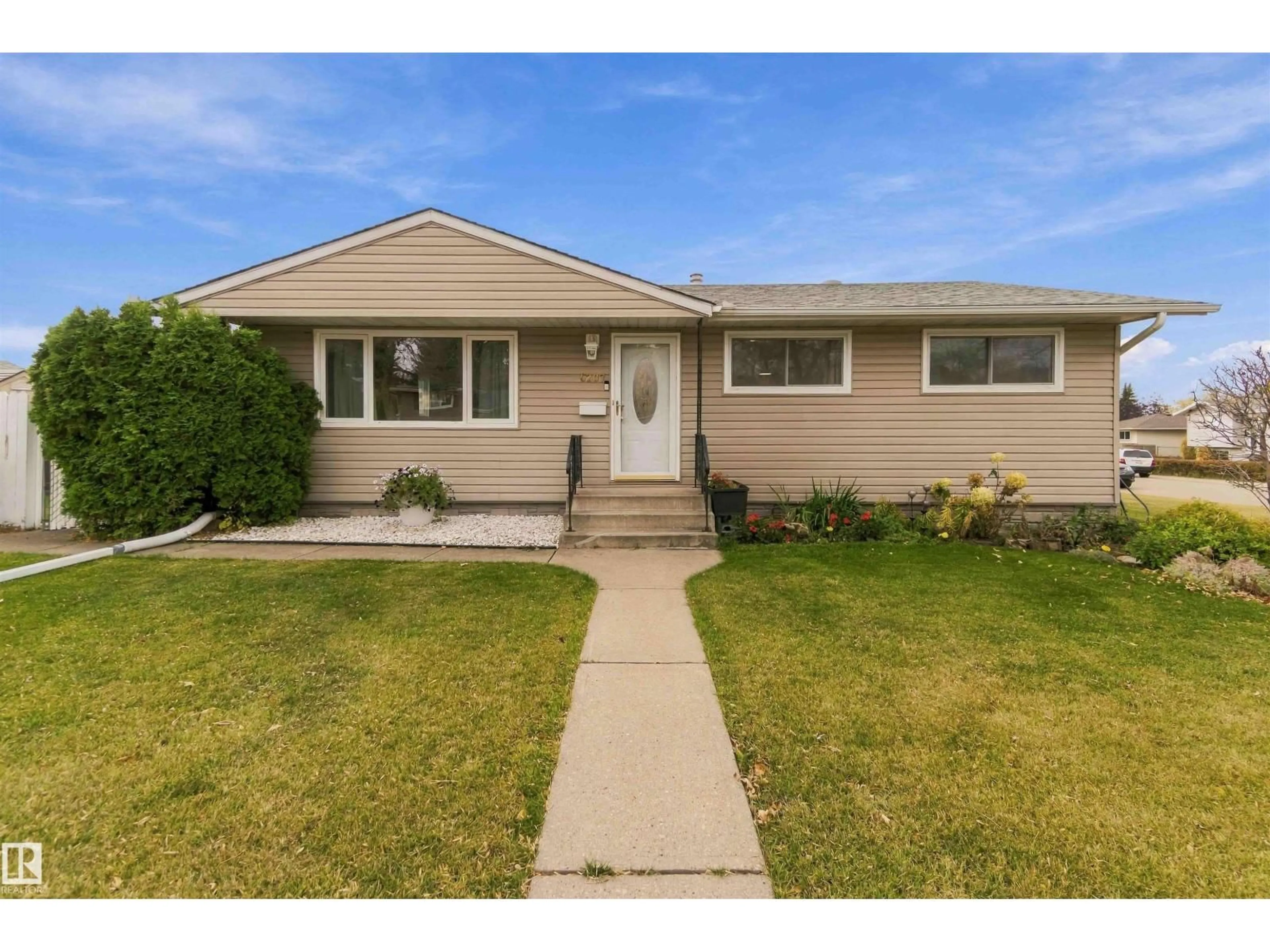 Home with vinyl exterior material, street for 6207 146 AV, Edmonton Alberta T5A1T2