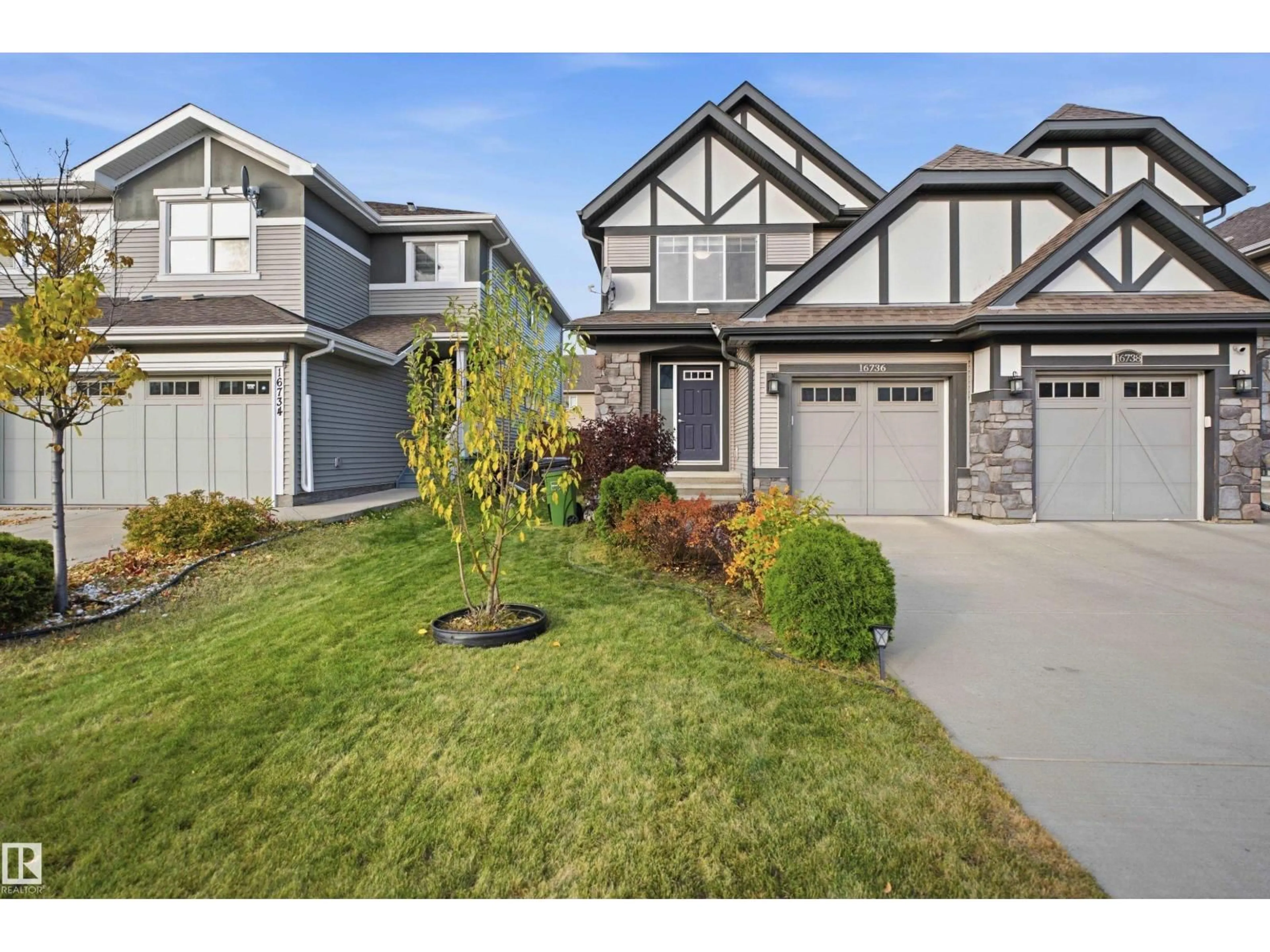 Home with vinyl exterior material, street for 16736 64 ST, Edmonton Alberta T5Y3P8