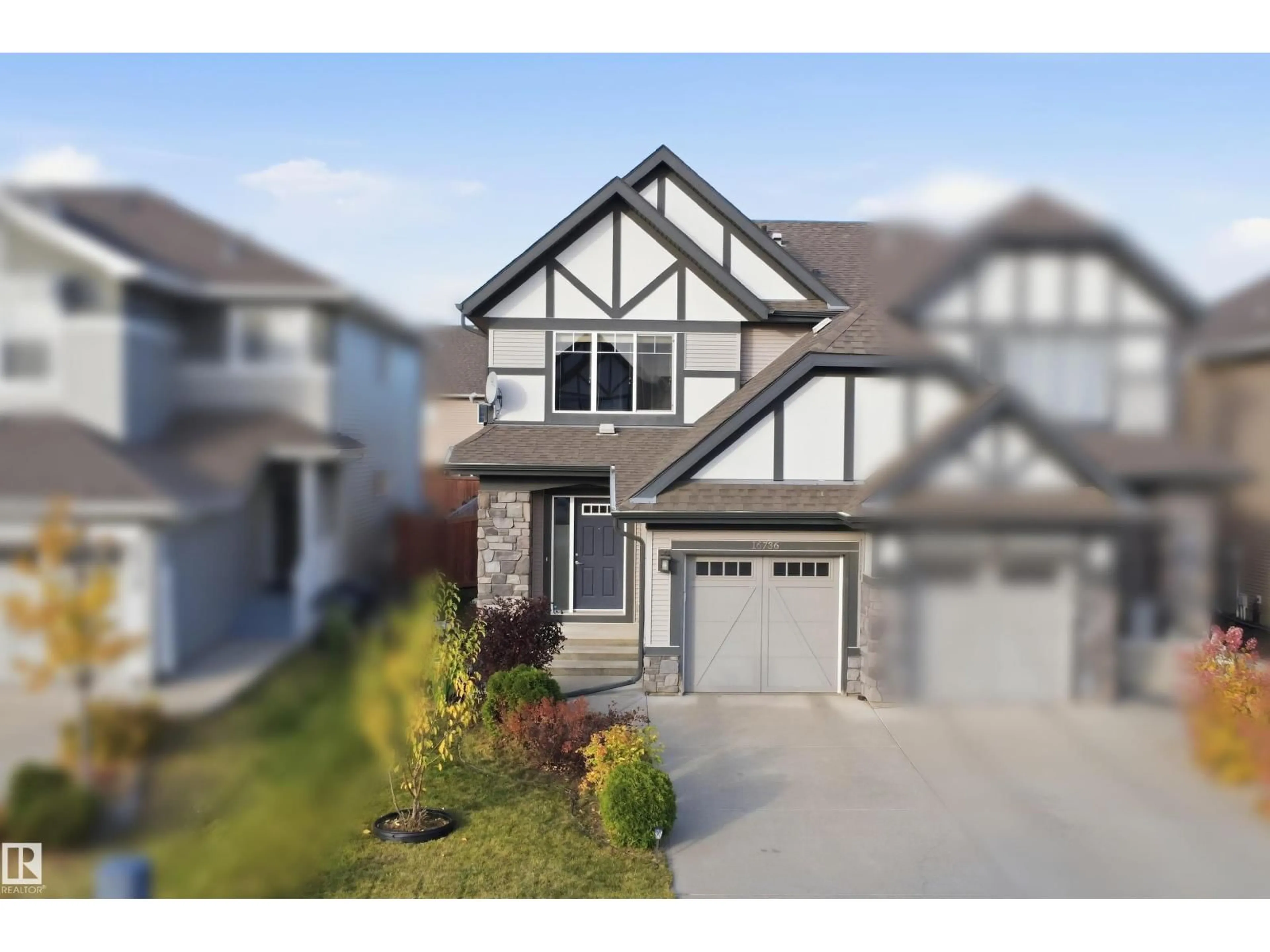 Home with vinyl exterior material, street for 16736 64 ST, Edmonton Alberta T5Y3P8