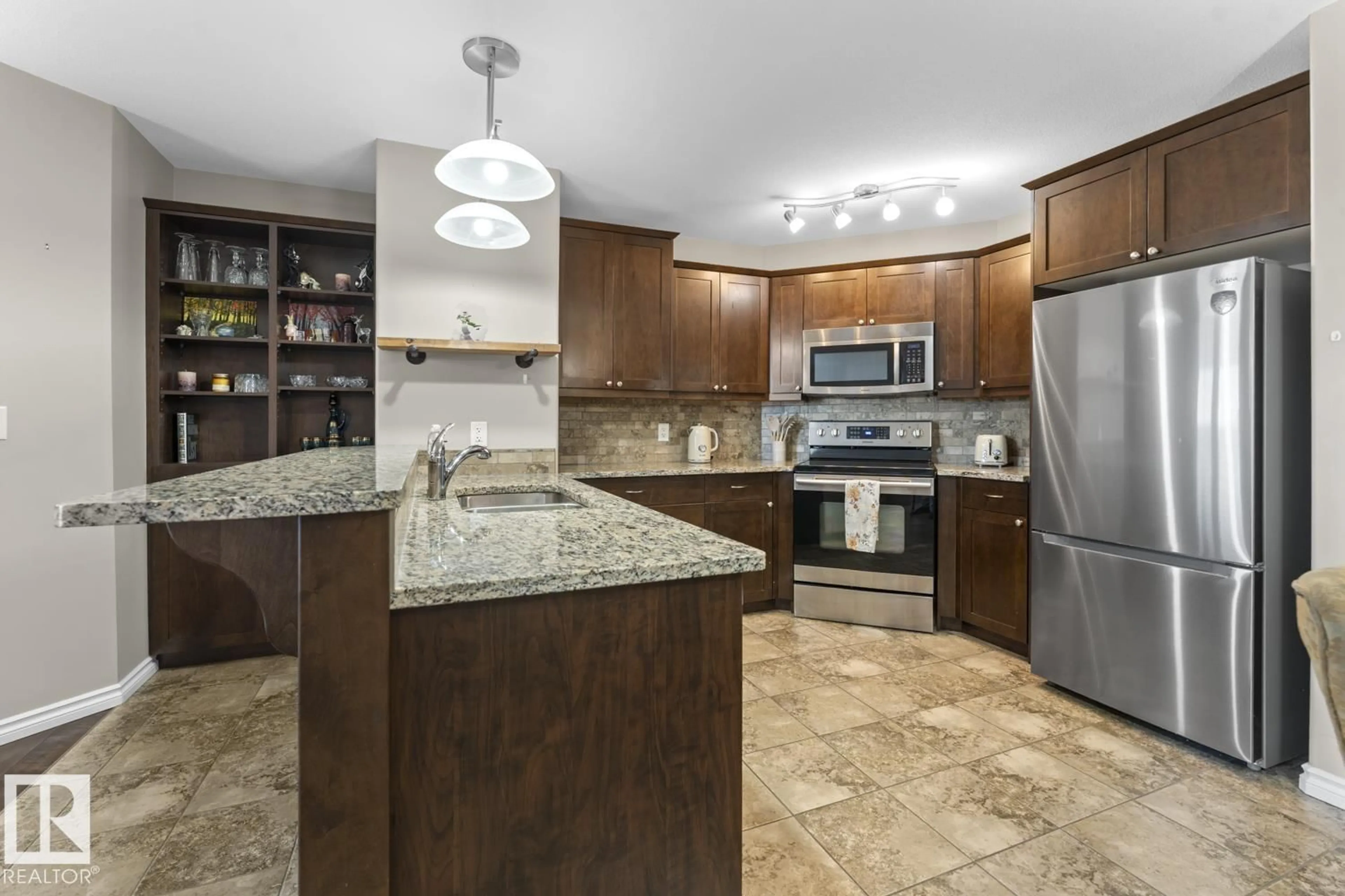 Open concept kitchen, ceramic/tile floor for 901 - 3407 16 ST, Cold Lake Alberta T9M1K1