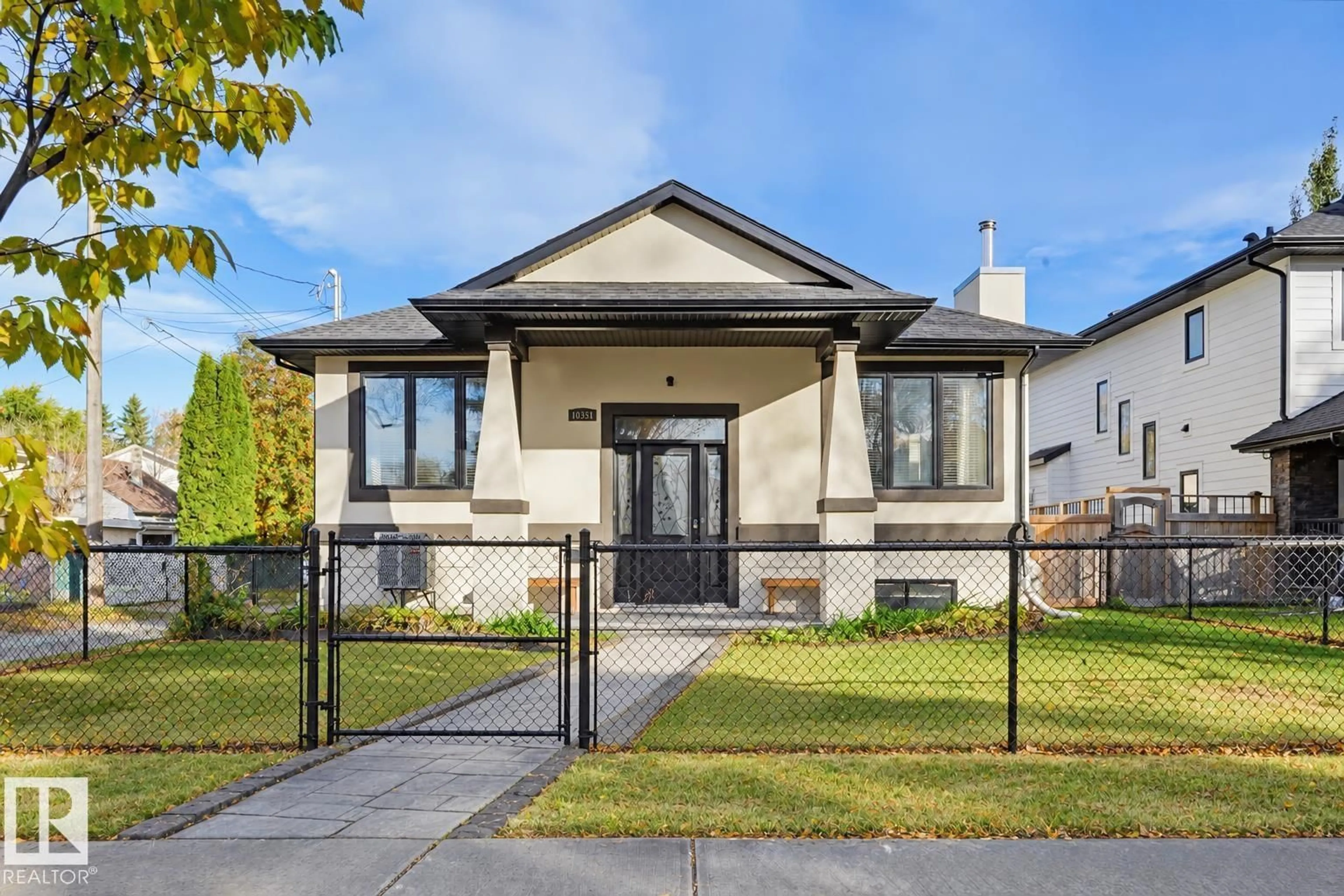 Home with vinyl exterior material, street for 10351 147 ST, Edmonton Alberta T5N3C2