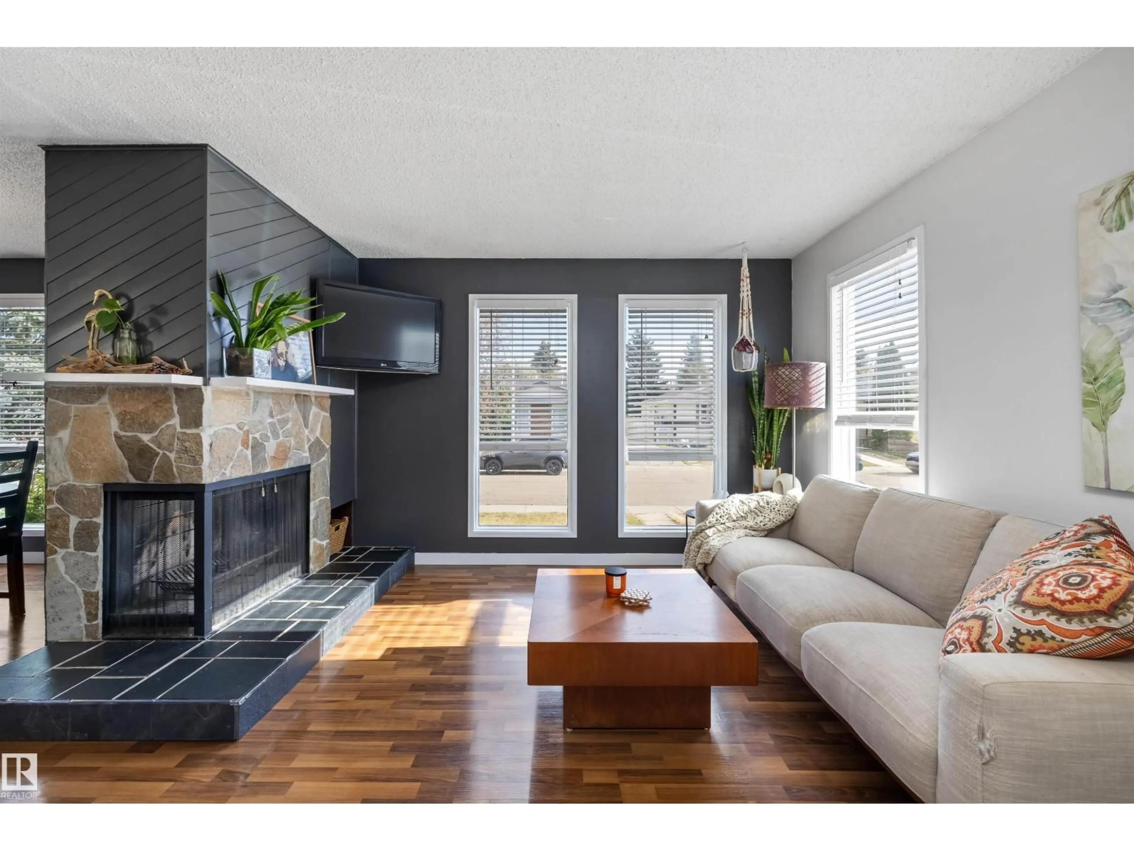 Living room with furniture, wood/laminate floor for NW - 14020 118 ST, Edmonton Alberta T5X4J8