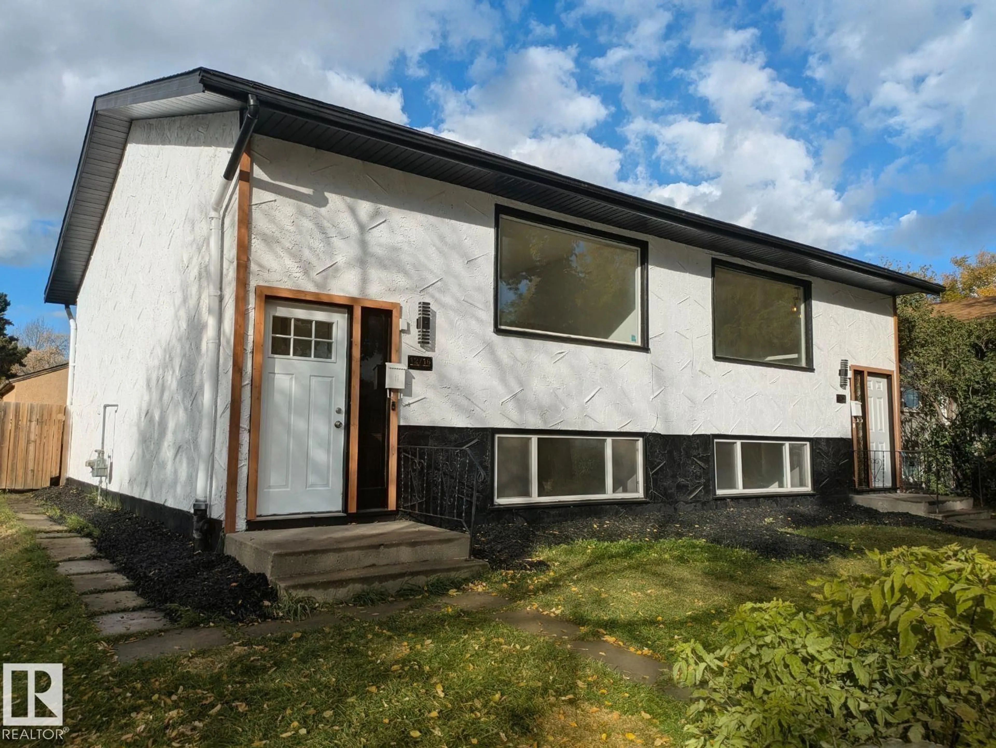 Home with vinyl exterior material, building for 12716 125 ST, Edmonton Alberta T5L0T7