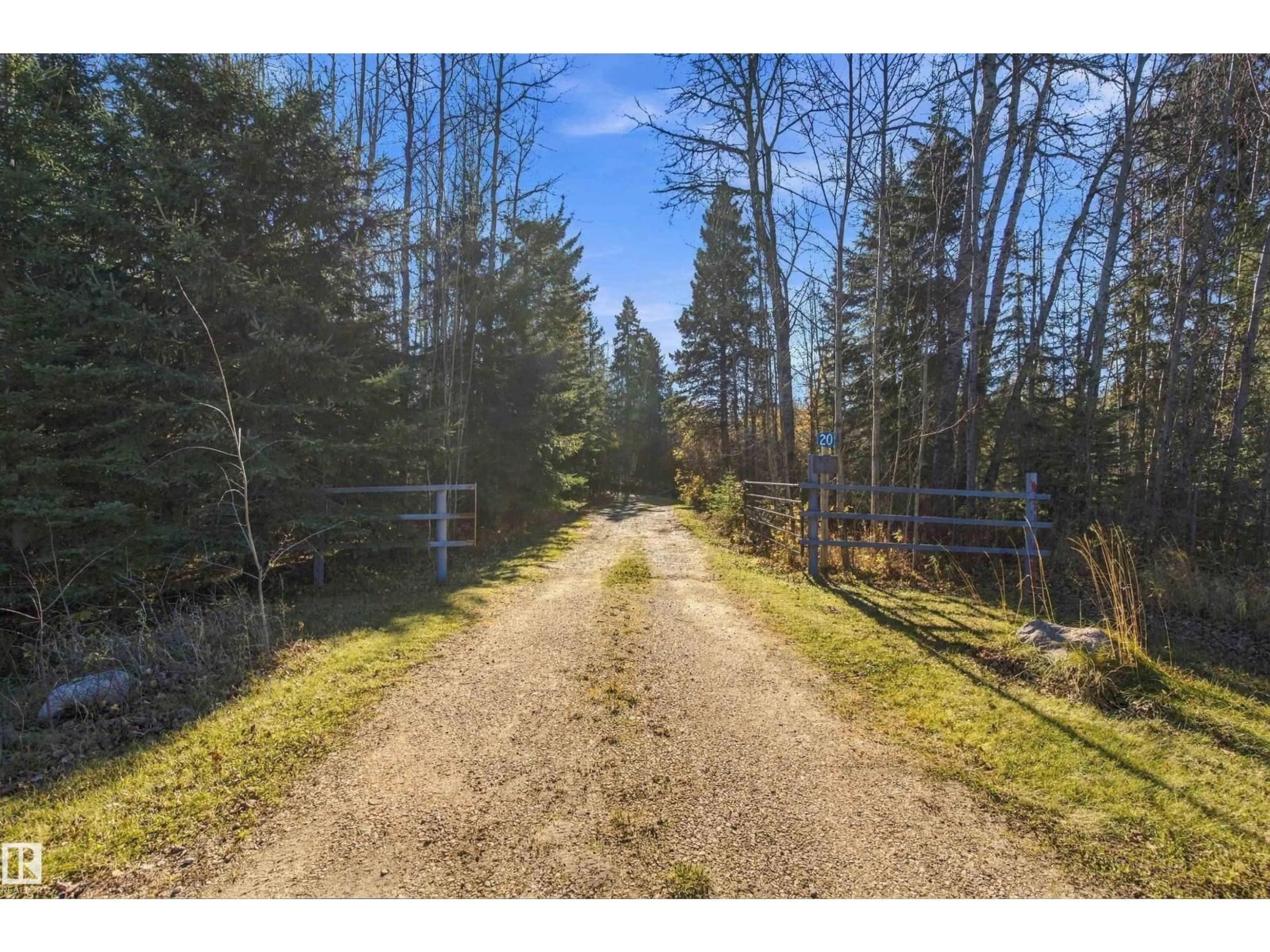 A pic from outside/outdoor area/front of a property/back of a property/a pic from drone, forest/trees view for 20 53513 RGE ROAD 35, Rural Lac Ste. Anne County Alberta T0E0A1