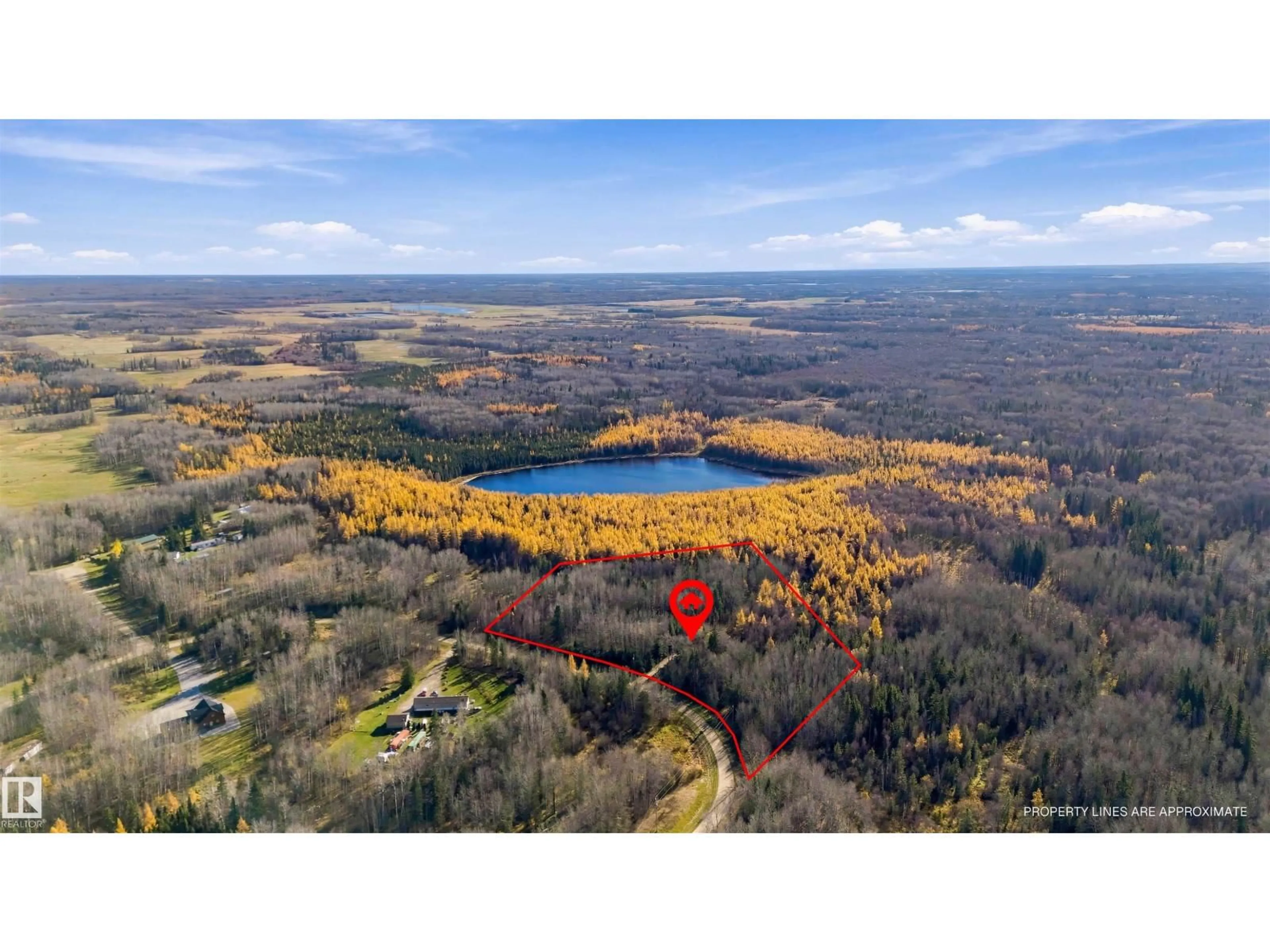 A pic from outside/outdoor area/front of a property/back of a property/a pic from drone, water/lake/river/ocean view for 20 53513 RGE ROAD 35, Rural Lac Ste. Anne County Alberta T0E0A1