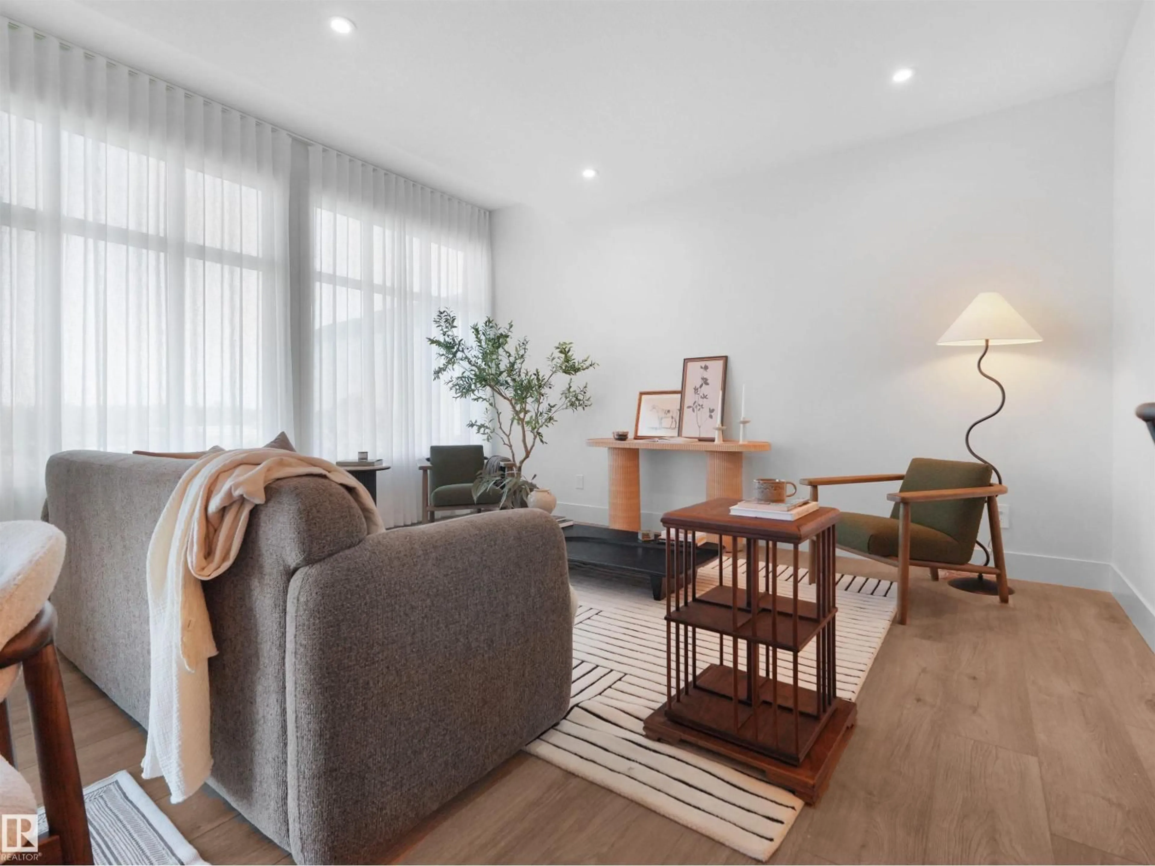 Living room with furniture, wood/laminate floor for SW - 8295 KIRIAK LO, Edmonton Alberta T6W5S2