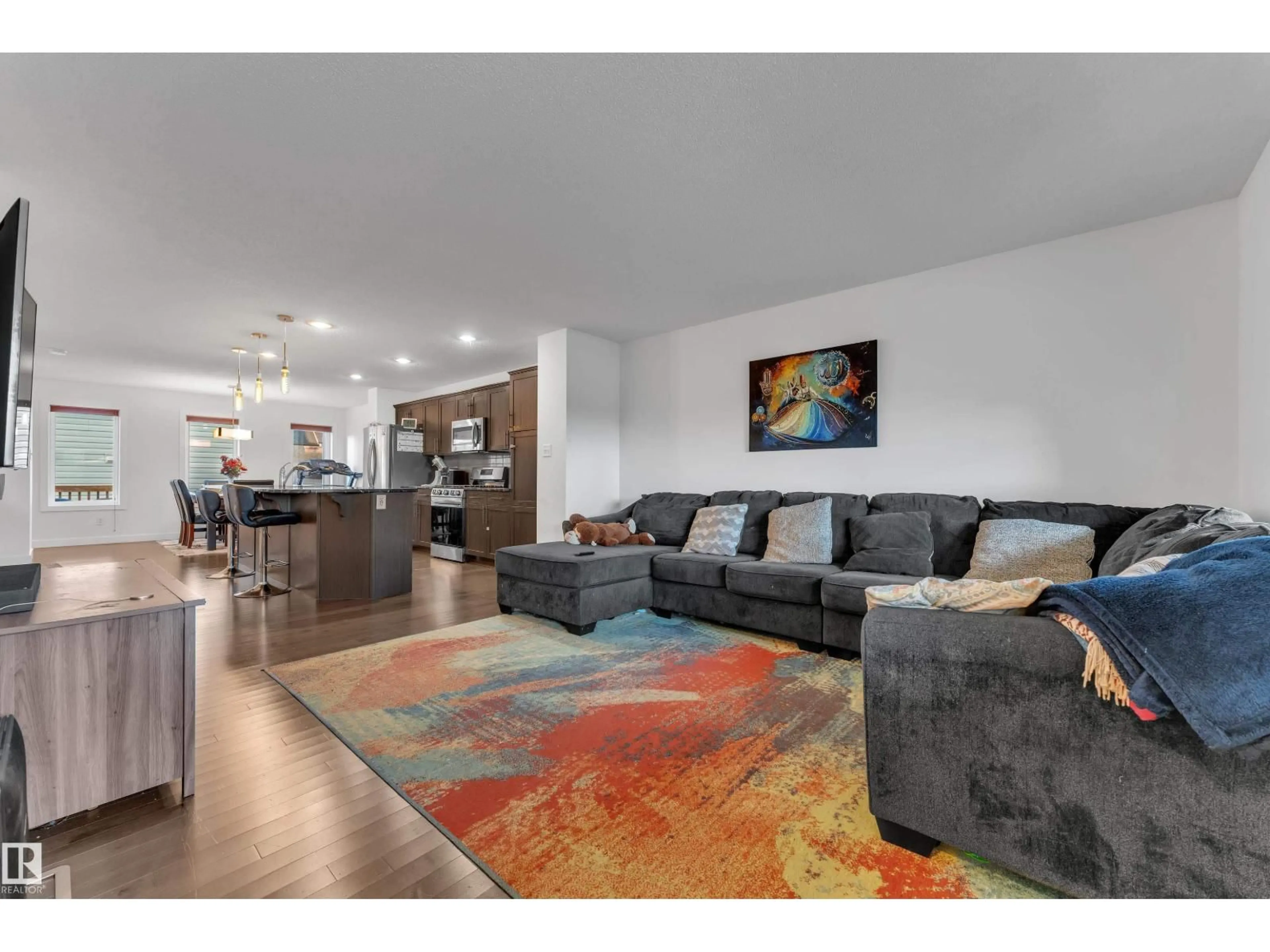 Living room with furniture, wood/laminate floor for SW SW - 16052 11 AV, Edmonton Alberta T6W2H6
