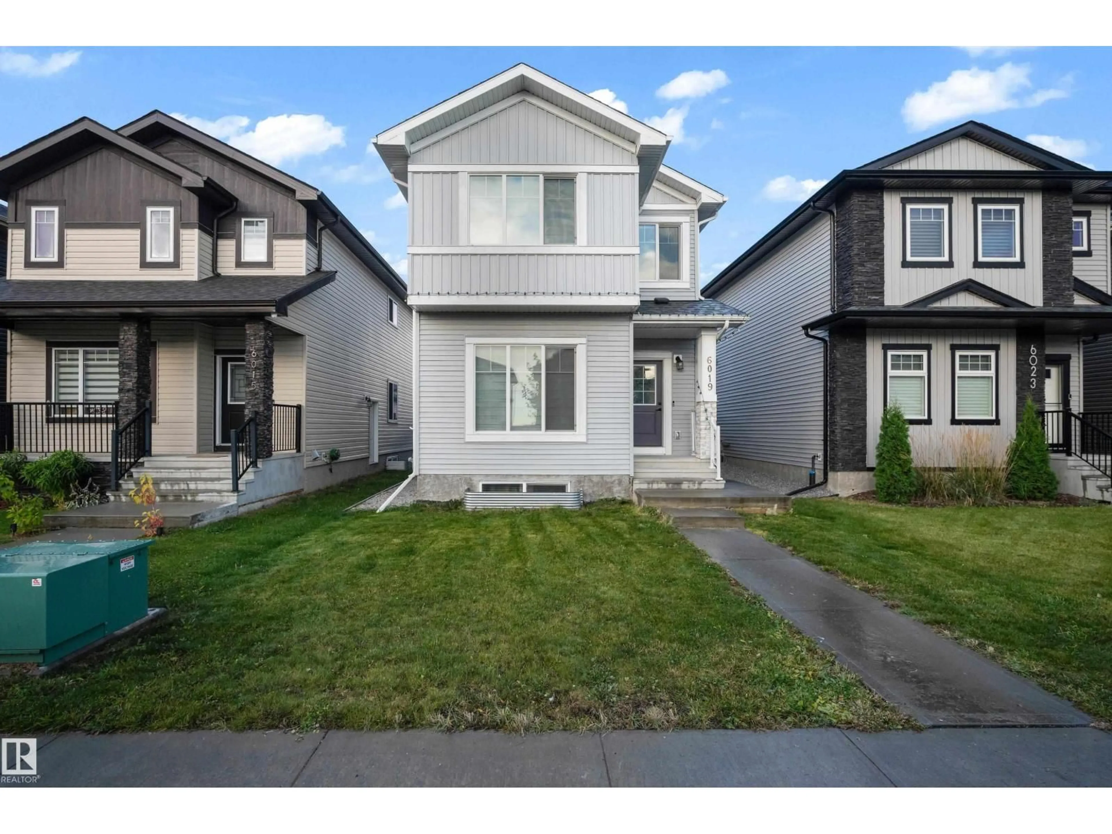 Home with vinyl exterior material, street for NW - 6019 180 AV, Edmonton Alberta T5Y3W9