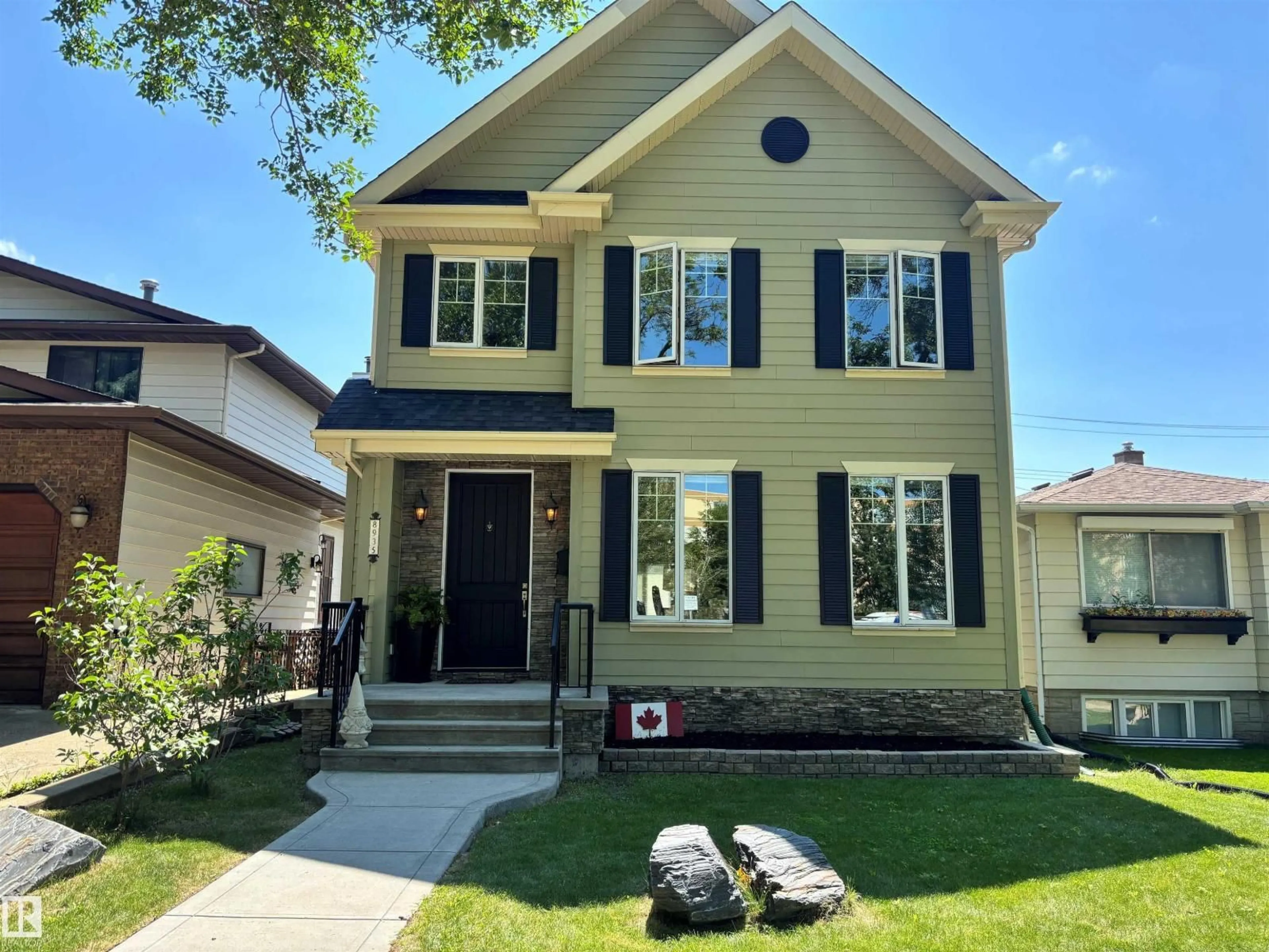 Home with vinyl exterior material, street for 8935 84 AV, Edmonton Alberta T6C1E3