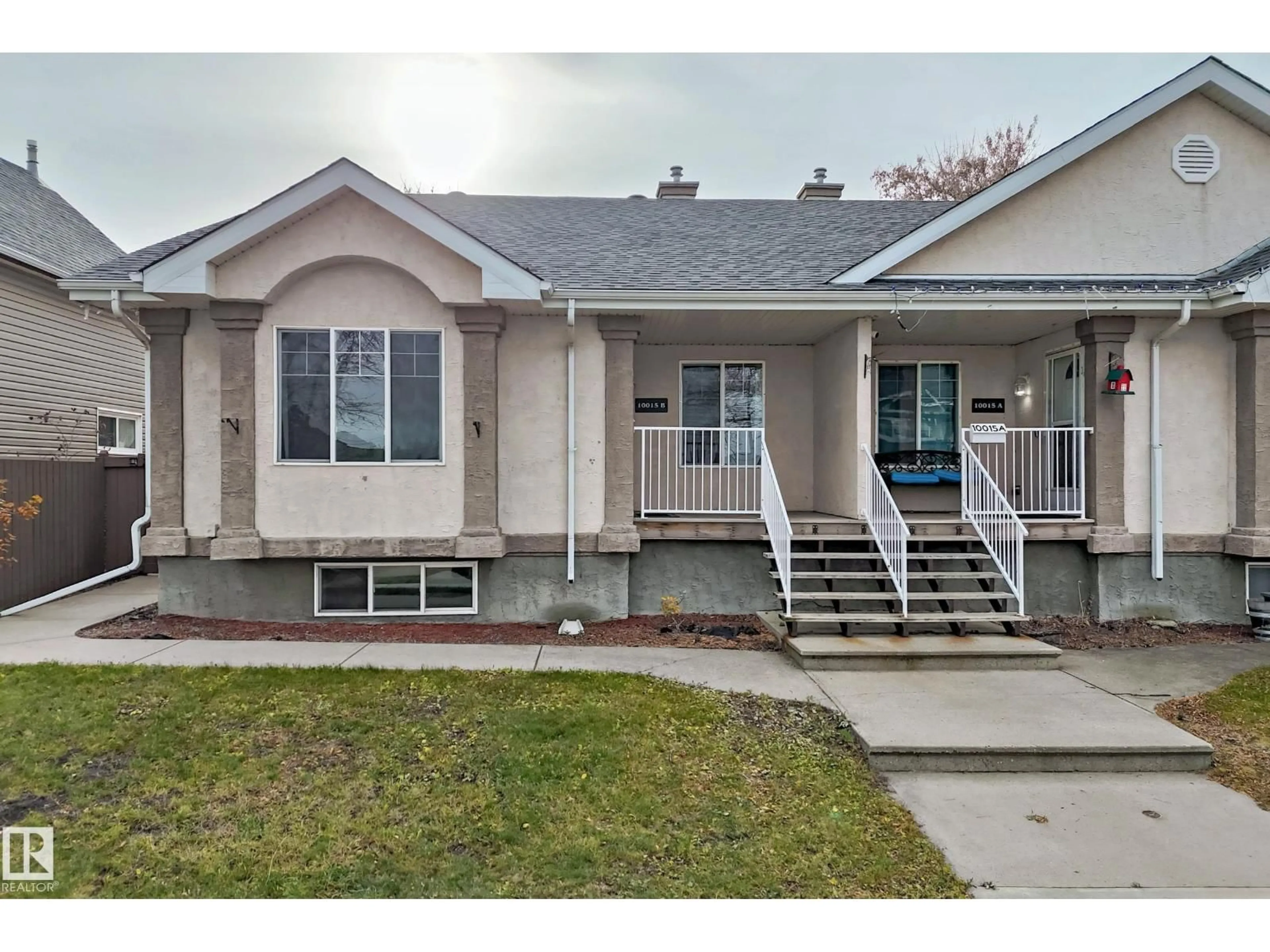 Home with vinyl exterior material, street for 10015B 97 AV, Fort Saskatchewan Alberta T8L1R3