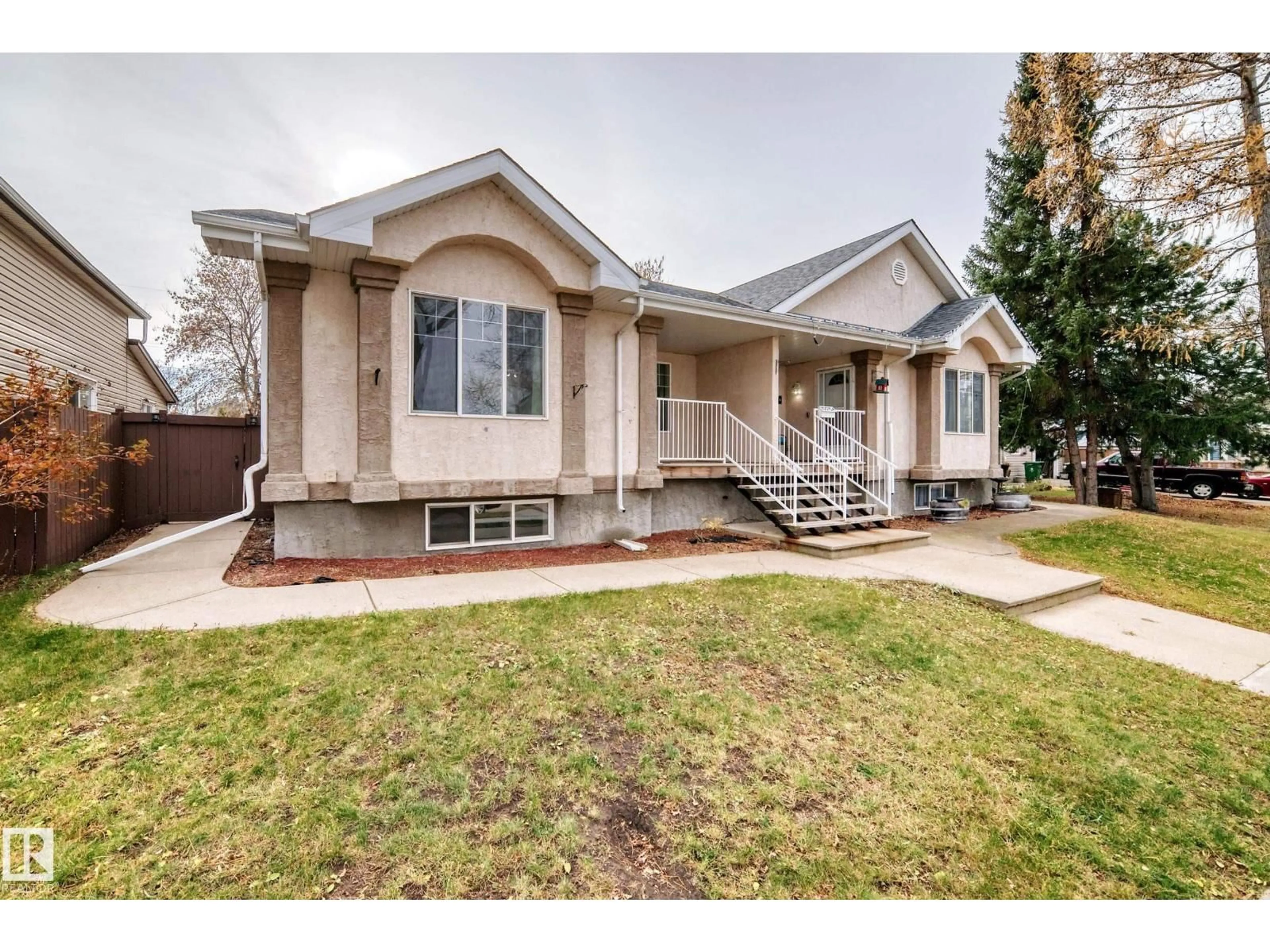 Home with vinyl exterior material, street for 10015B 97 AV, Fort Saskatchewan Alberta T8L1R3