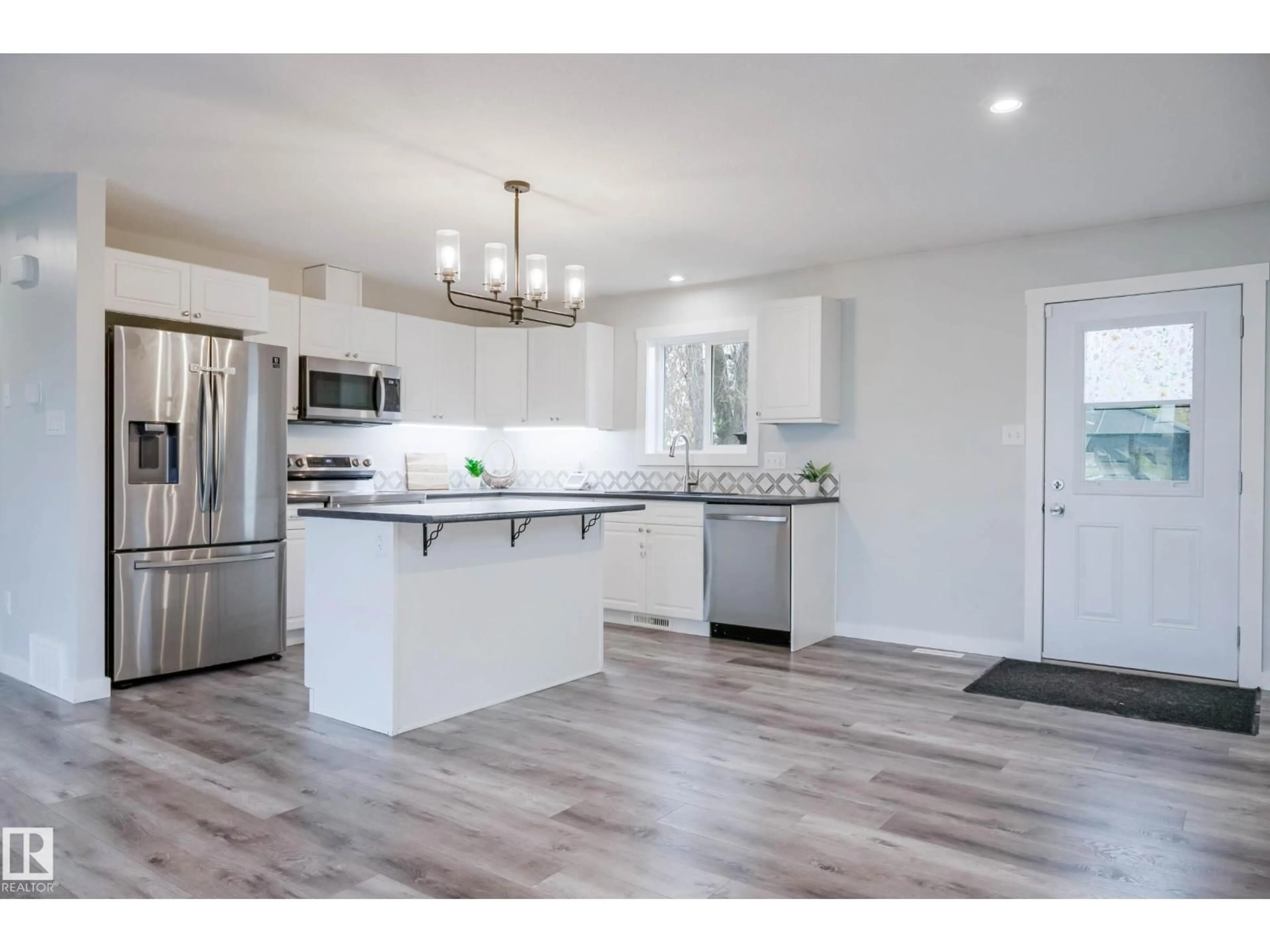 Open concept kitchen, wood/laminate floor for 5315 57A ST, Cold Lake Alberta T9M1R9