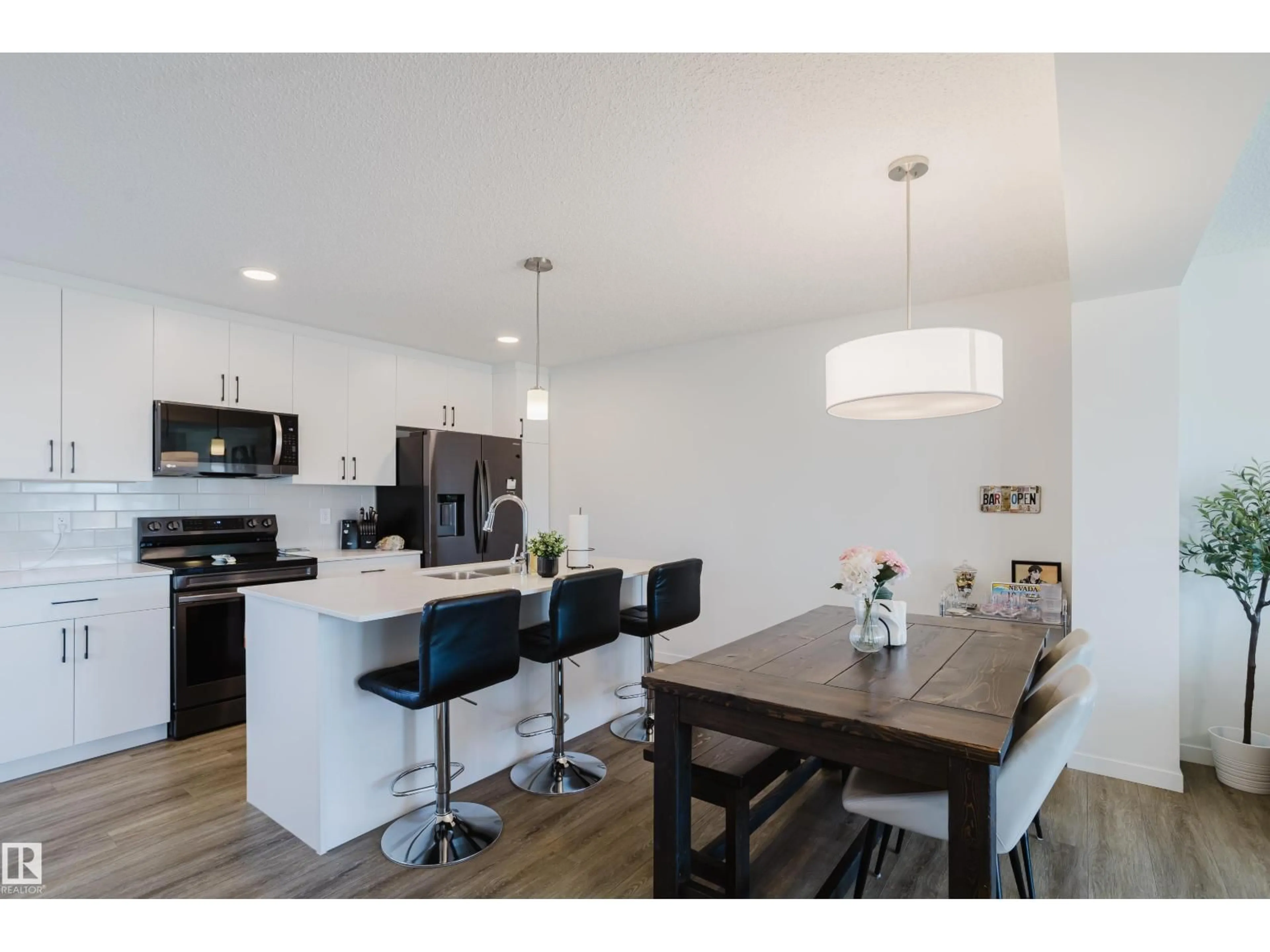 Open concept kitchen, wood/laminate floor for 49 SECORD BV, Edmonton Alberta T5T7R9