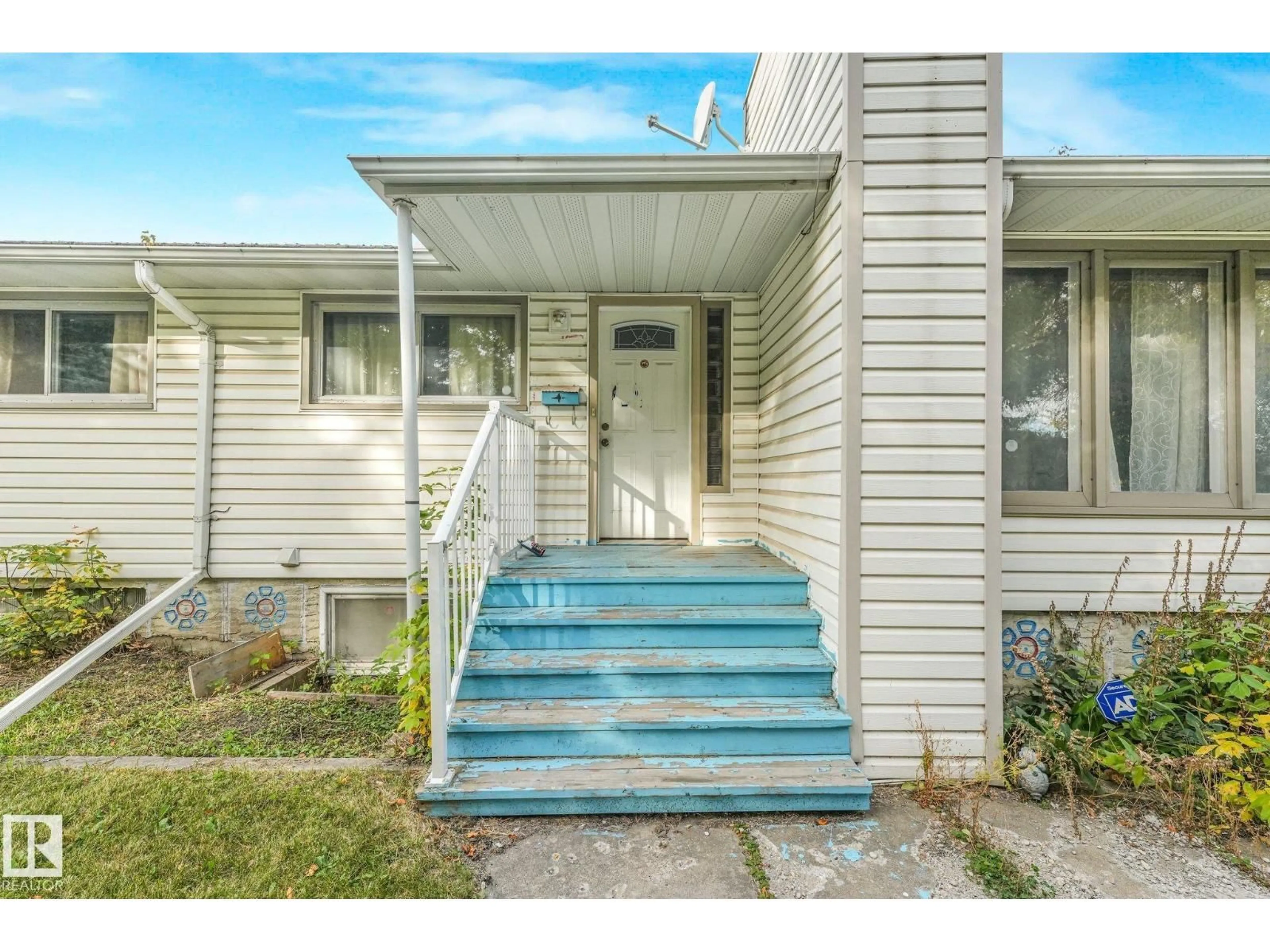Home with vinyl exterior material, street for NW - 11716 130 ST, Edmonton Alberta T5M1A8