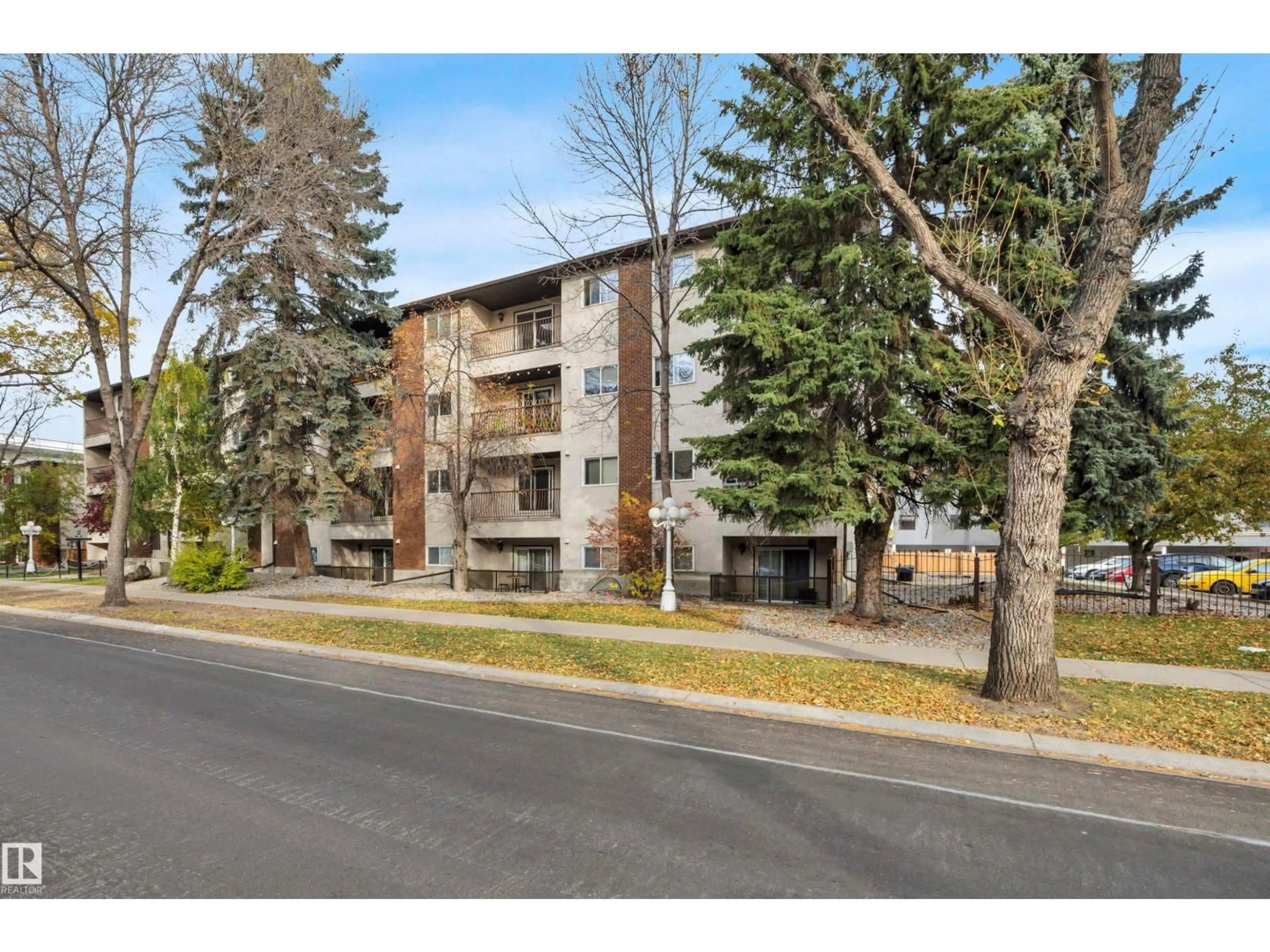 A pic from outside/outdoor area/front of a property/back of a property/a pic from drone, street for #006 - 10520 80 AV, Edmonton Alberta T6E1V3