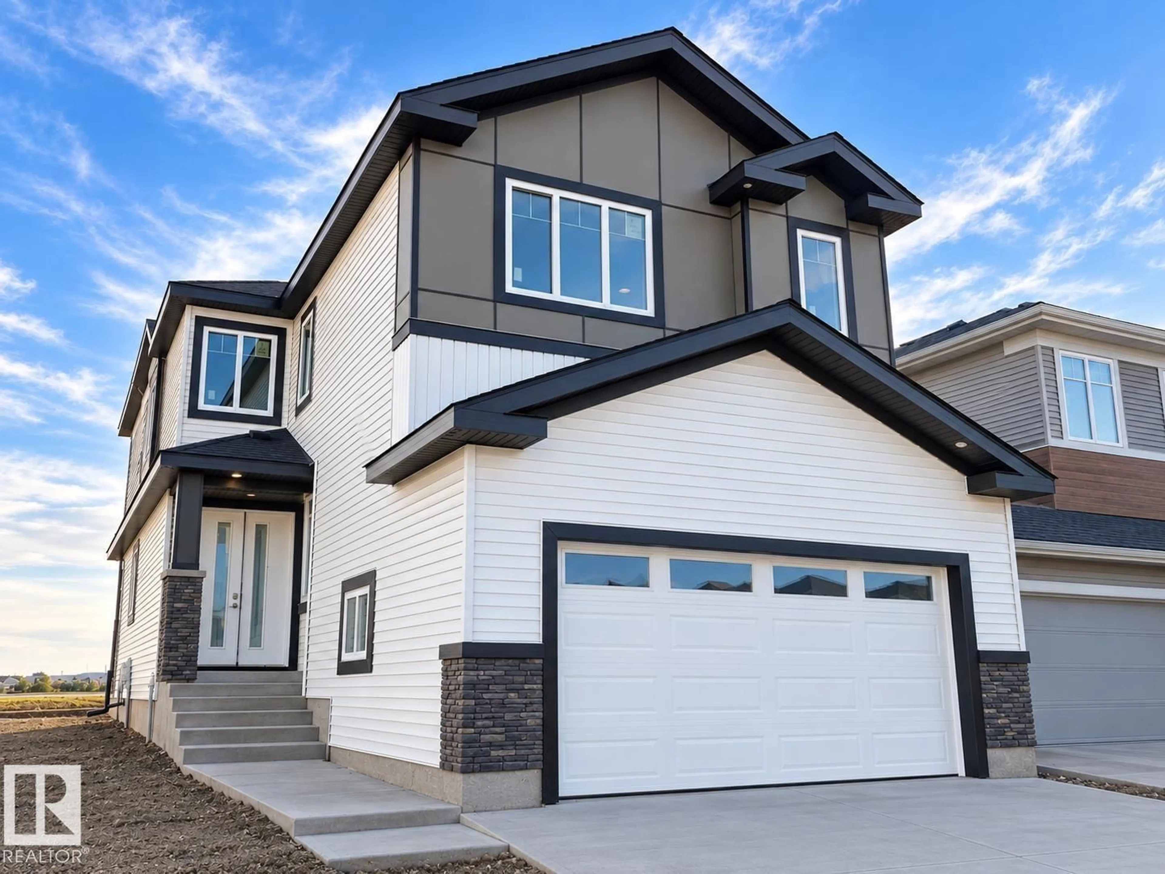 Home with vinyl exterior material, street for 6941 176A AVE, Edmonton Alberta T5Z0W8
