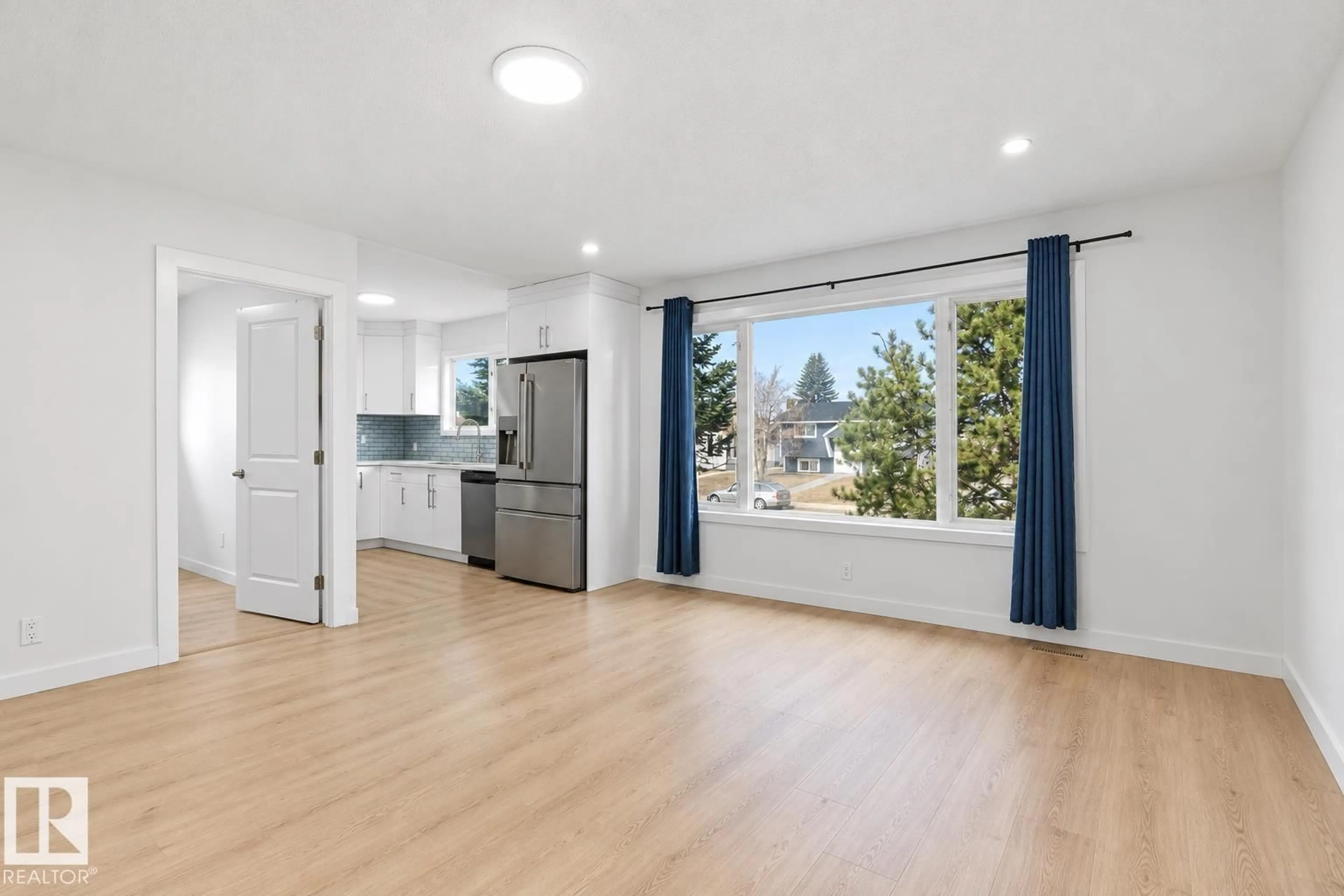 Open concept kitchen, wood/laminate floor for 1566 LAKEWOOD RD, Edmonton Alberta T6K2V9