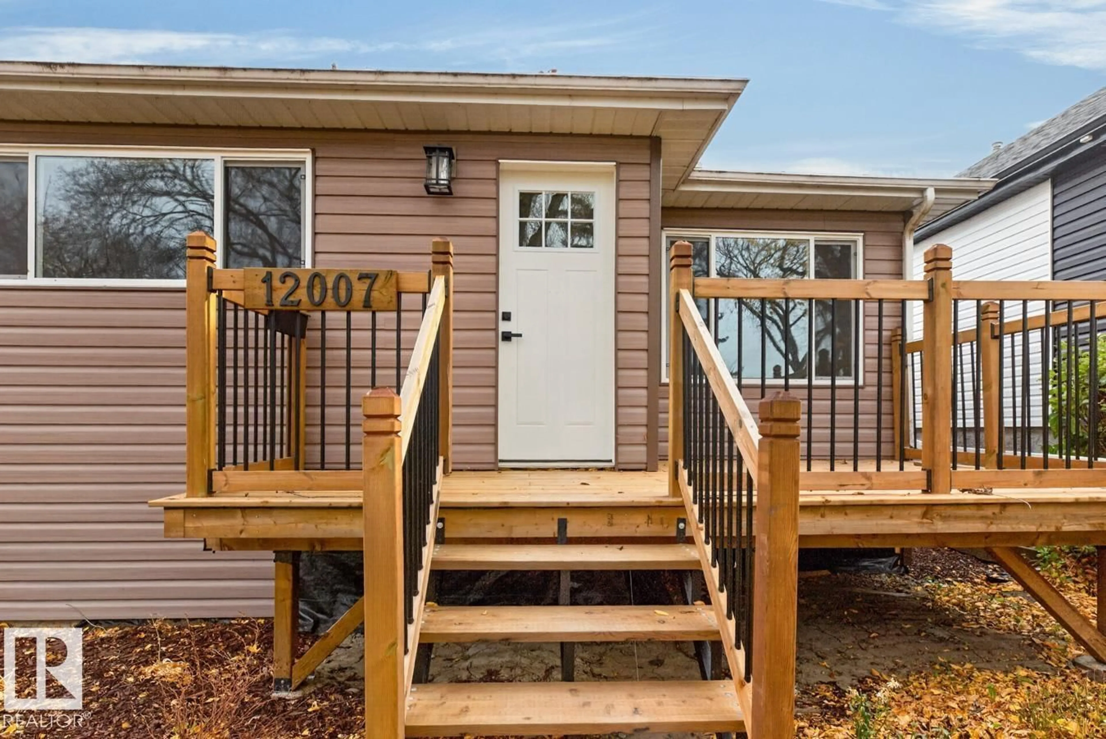 Home with vinyl exterior material, street for NW - 12007 69 ST, Edmonton Alberta T5B1S7