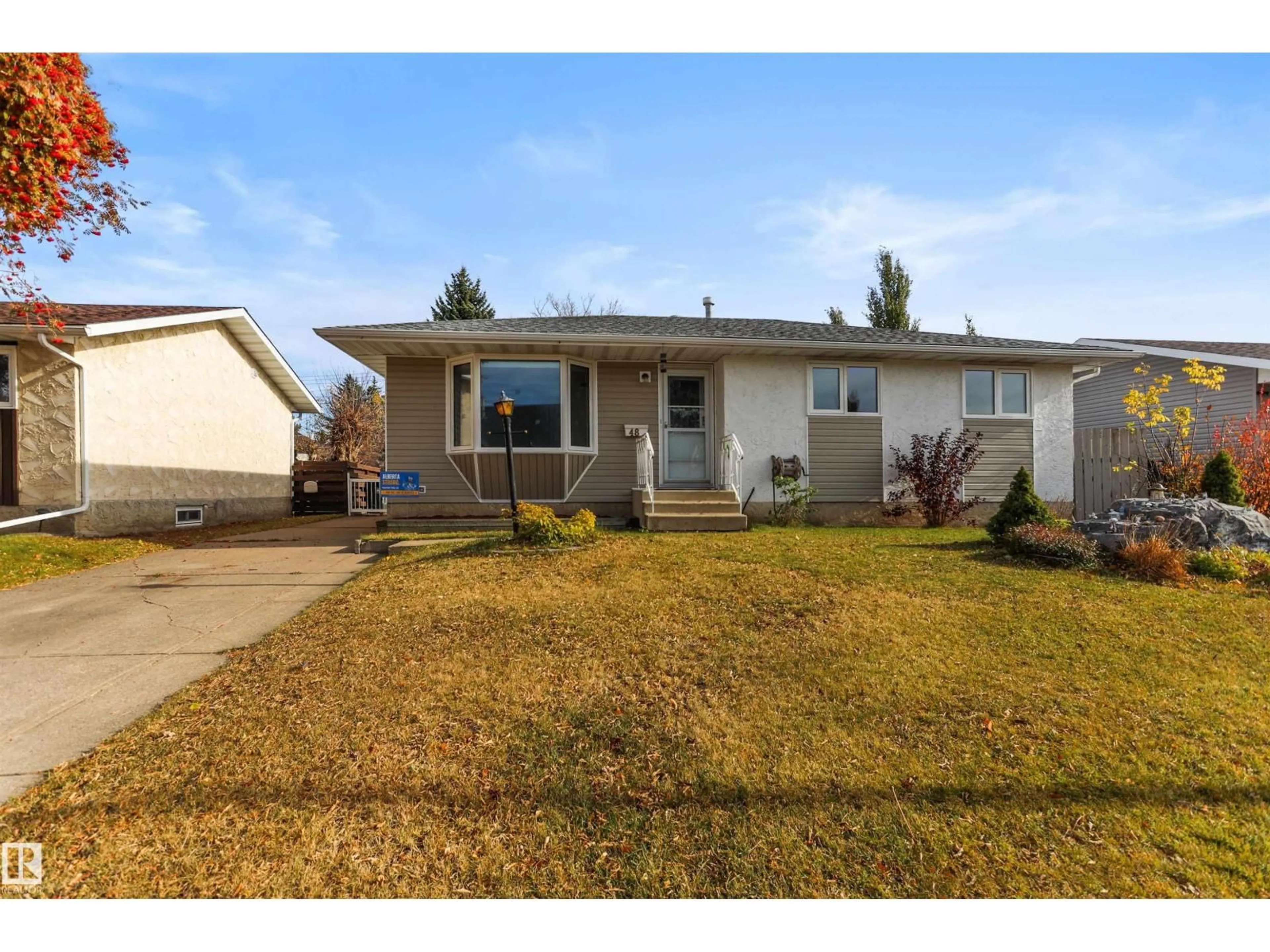 Home with vinyl exterior material, street for 48 PIPESTONE DR, Devon Alberta T9G1T3