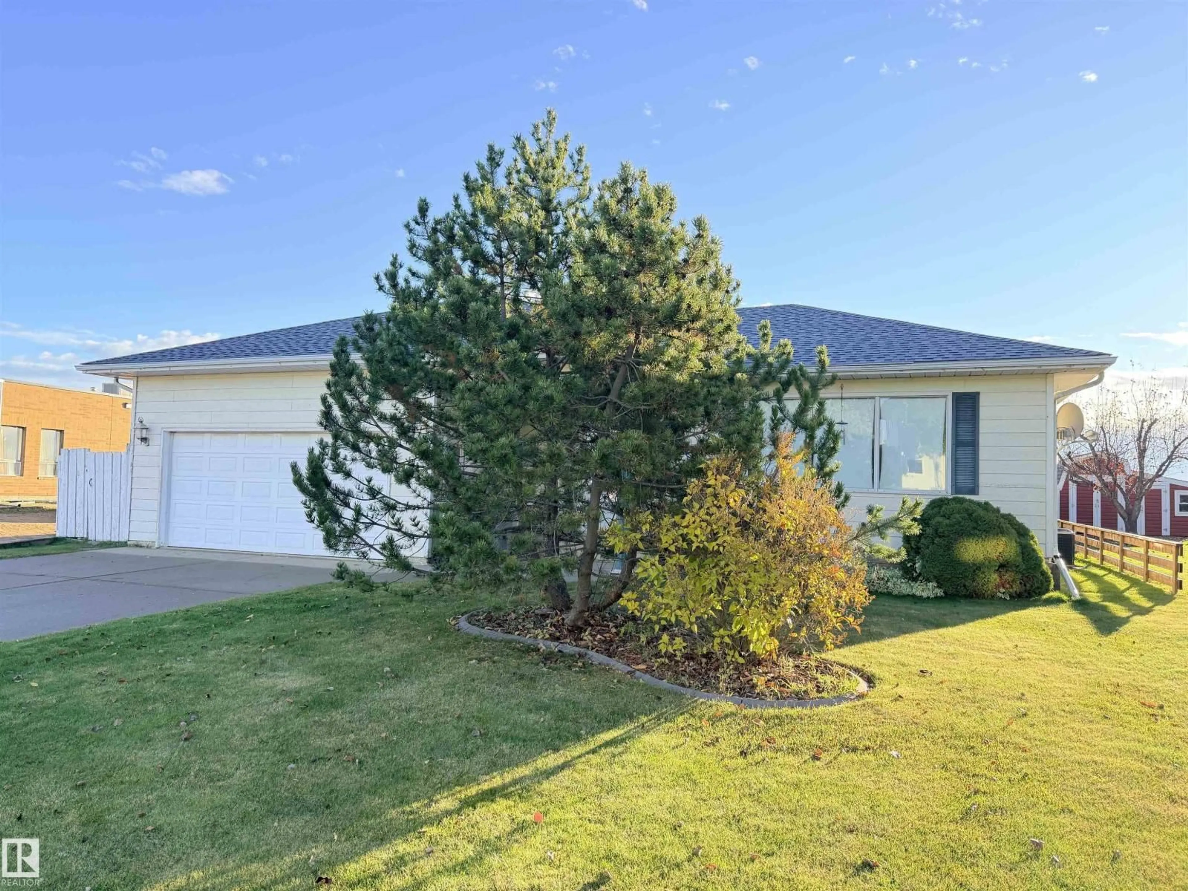 A pic from outside/outdoor area/front of a property/back of a property/a pic from drone, mountain view for 10751 109 AV, Westlock Alberta T7P1B9