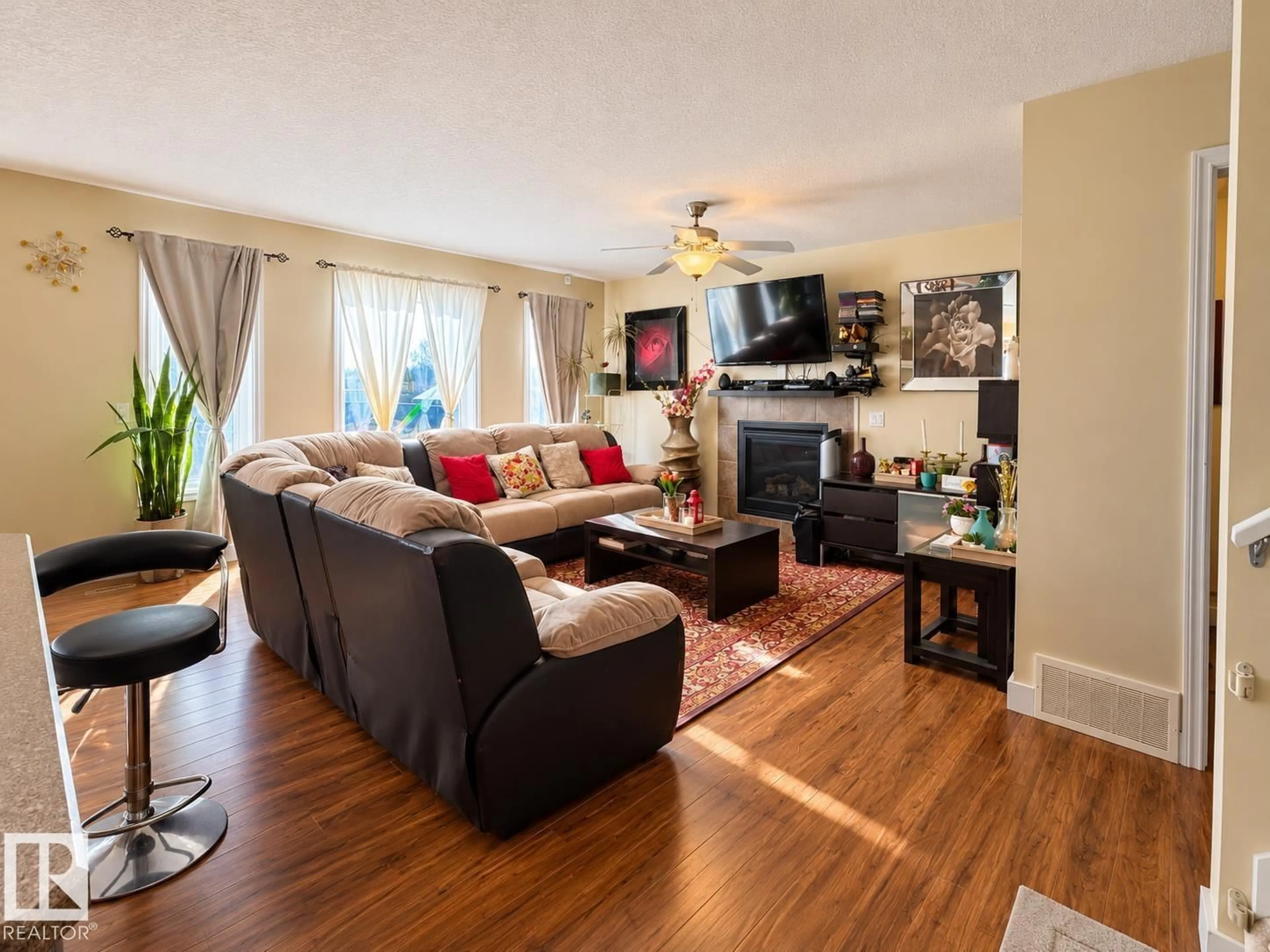 Living room with furniture, wood/laminate floor for 5637 51 AV, Bruderheim Alberta T0B0S0