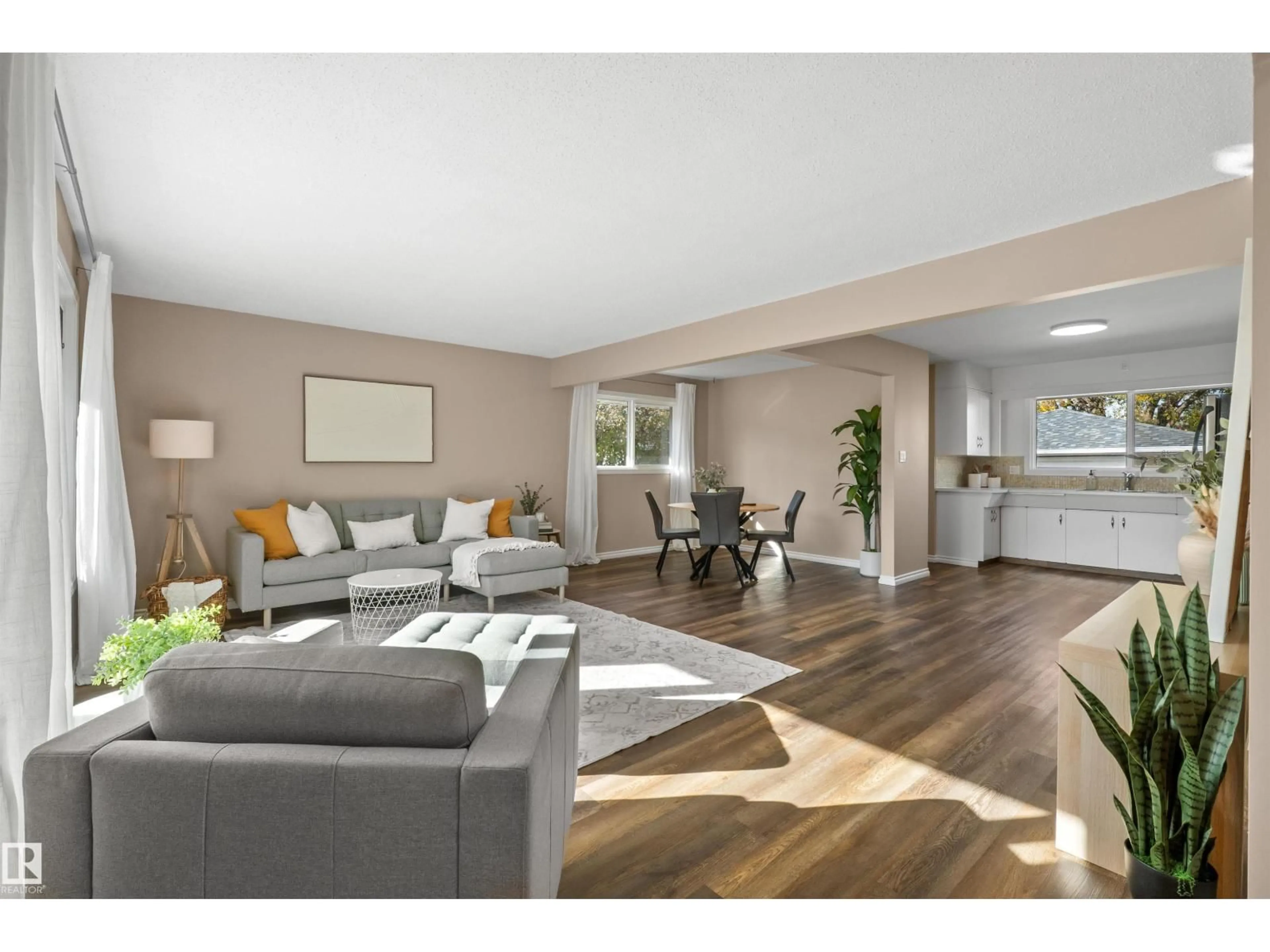 Living room with furniture, wood/laminate floor for 10420 36A AV, Edmonton Alberta T6J2H6