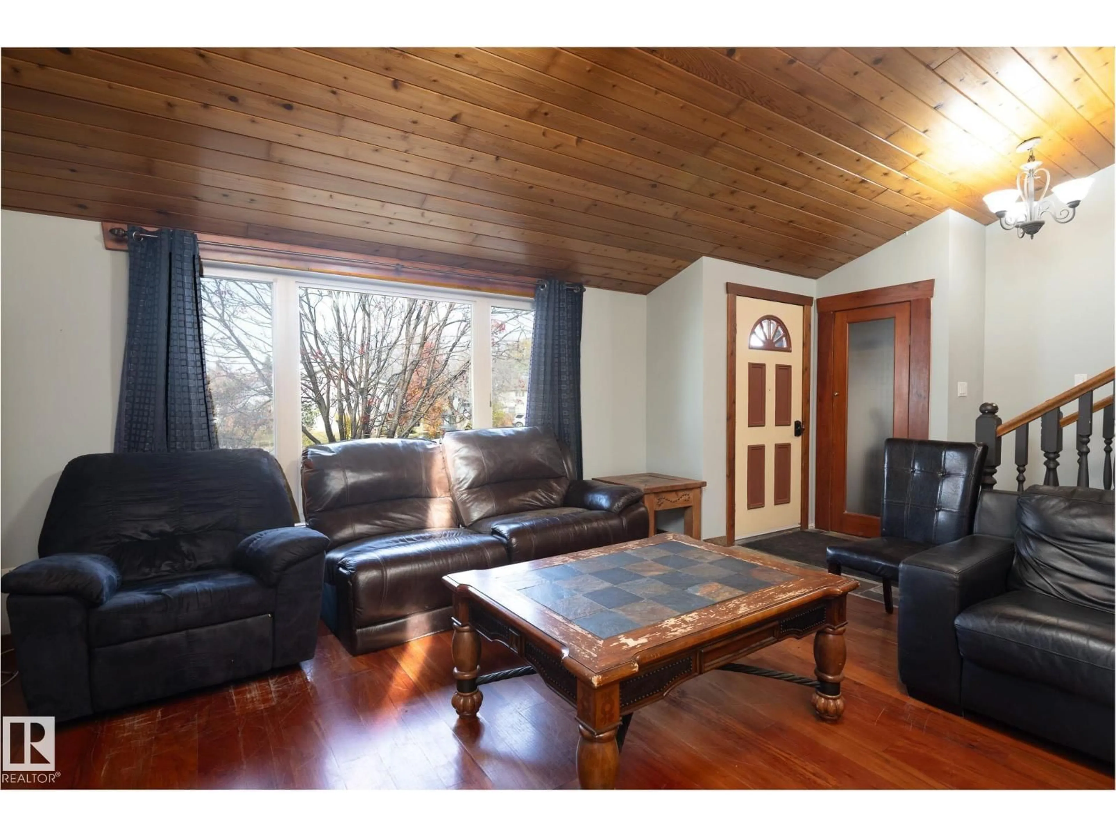 Living room with furniture, wood/laminate floor for 2003 4 AV, Cold Lake Alberta T9M1E1