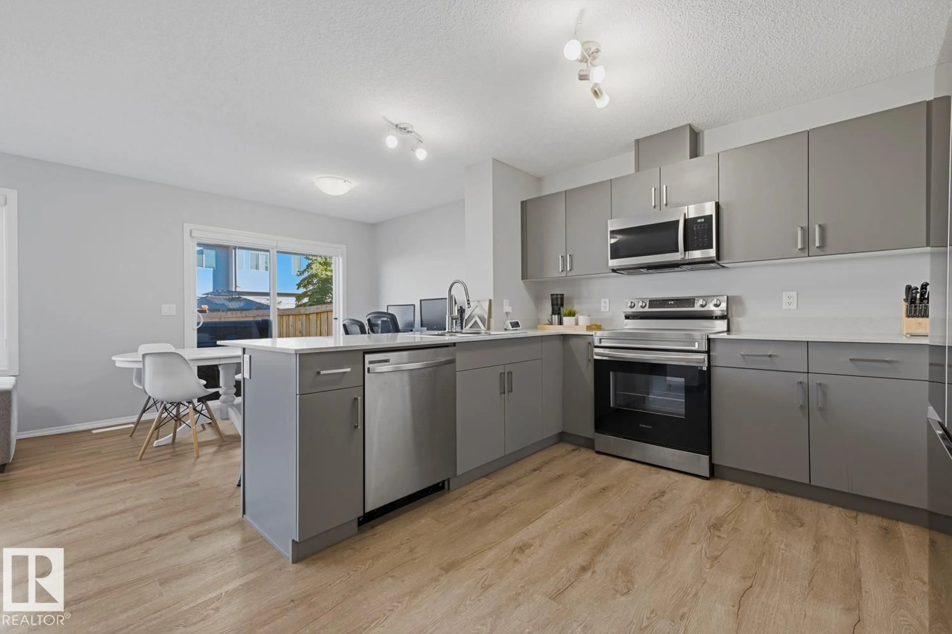 Open concept kitchen, unknown for SW - 9324 COOPER BN, Edmonton Alberta T6W4M4