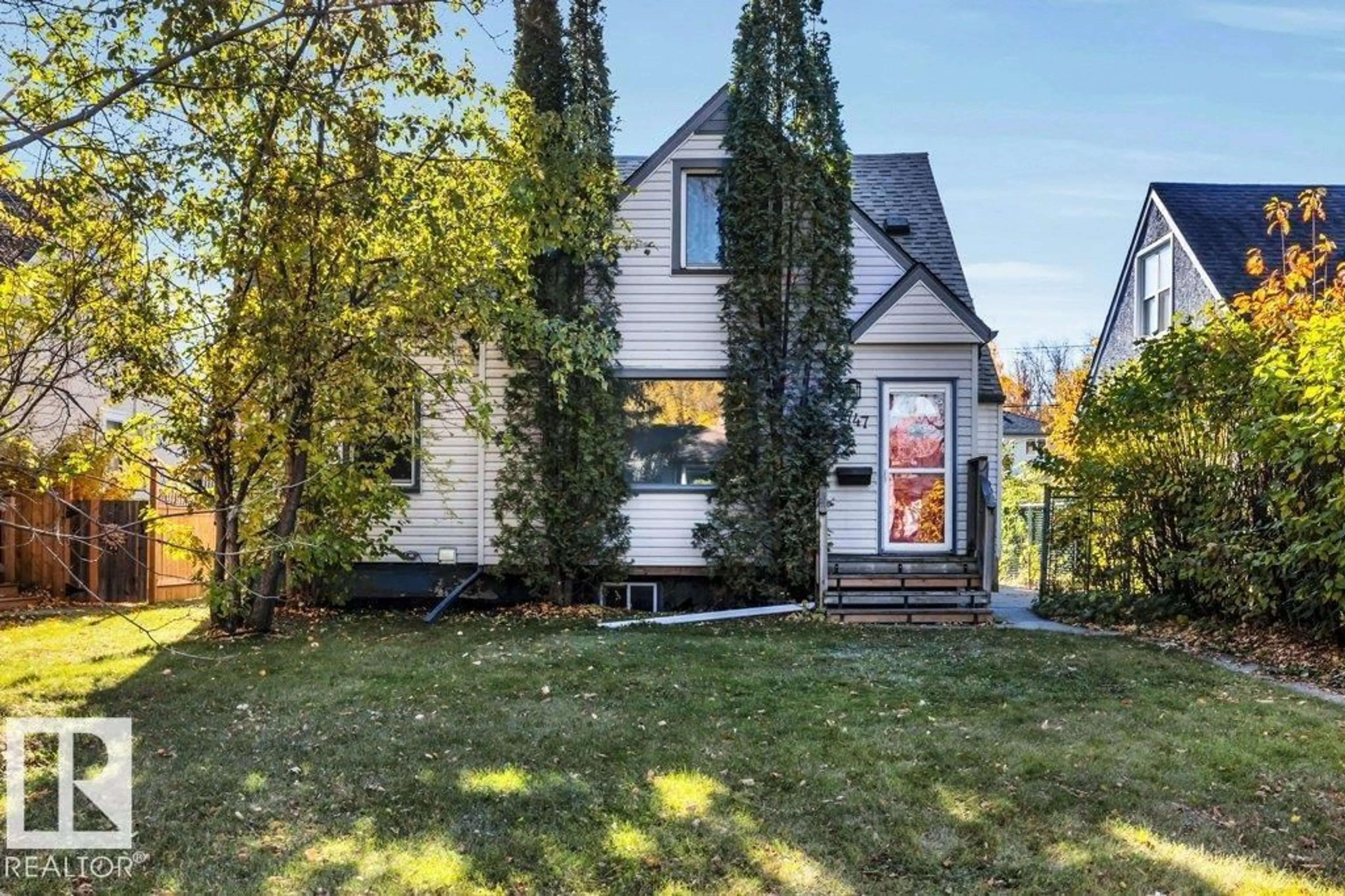 Home with vinyl exterior material, street for NW - 7747 79 AV, Edmonton Alberta T6C0P5