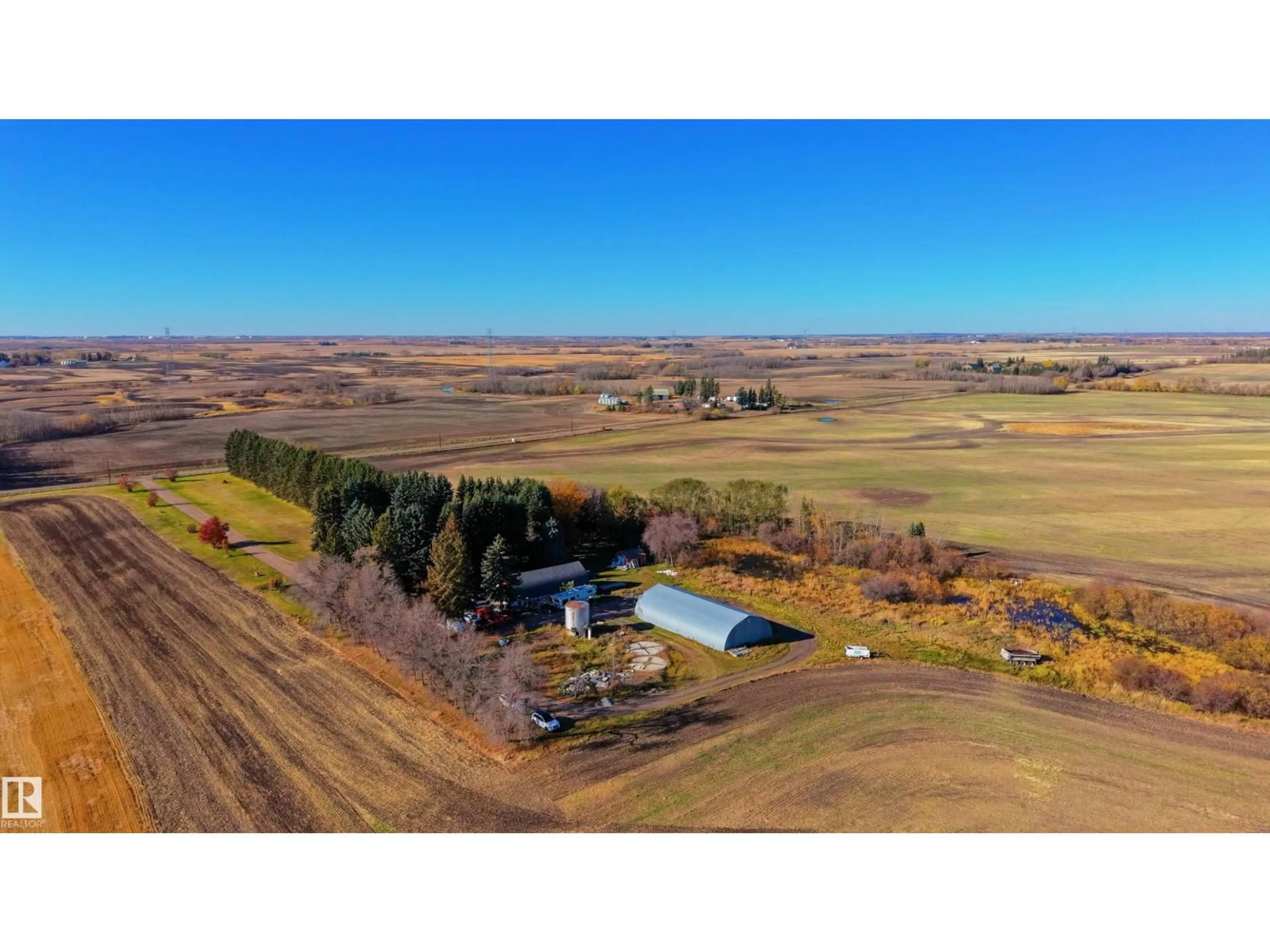 A pic from outside/outdoor area/front of a property/back of a property/a pic from drone, water/lake/river/ocean view for 20351 18 ST, Edmonton Alberta T5Y6B7