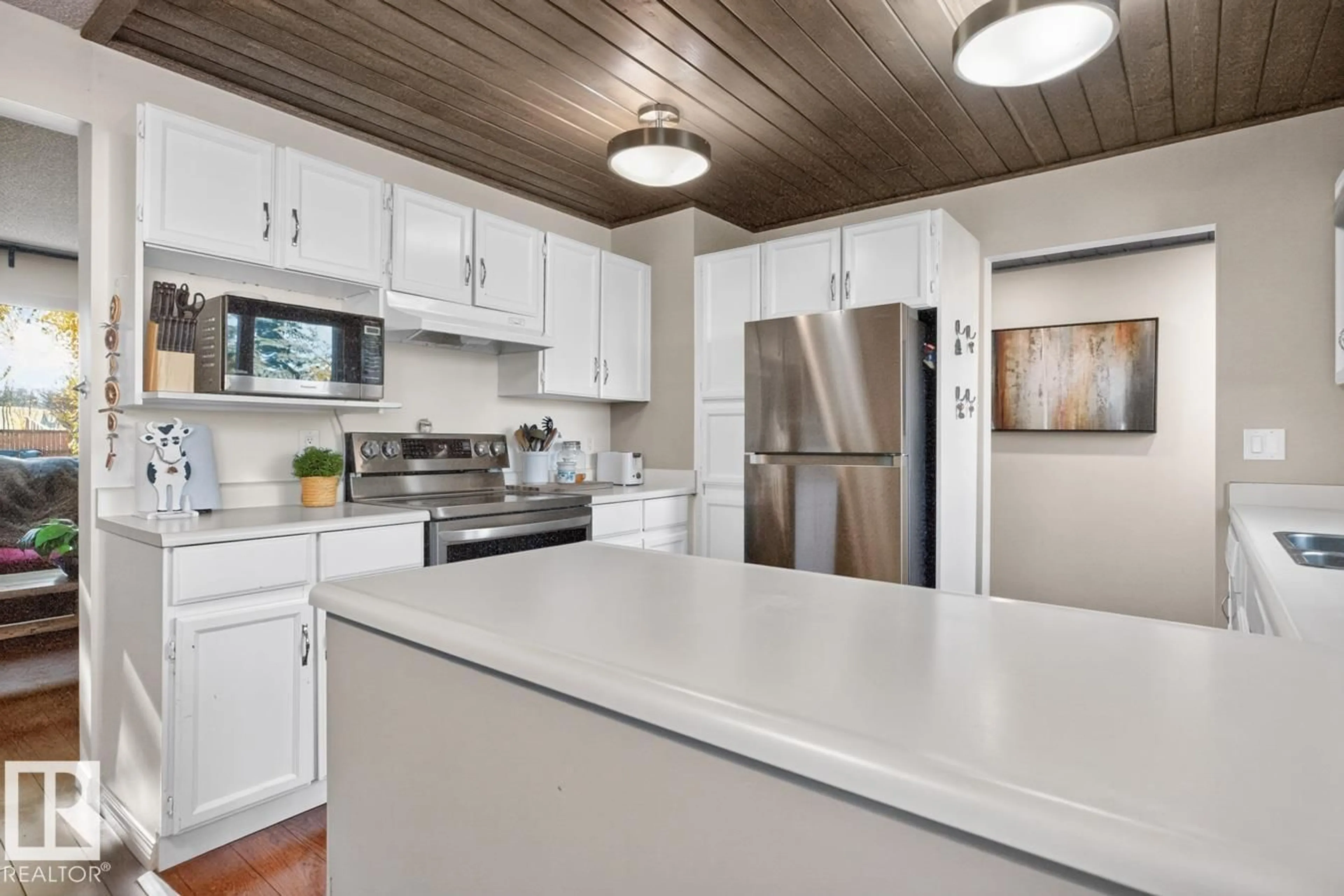 Open concept kitchen, wood/laminate floor for 43 MORELAND CR, Sherwood Park Alberta T8A0P8