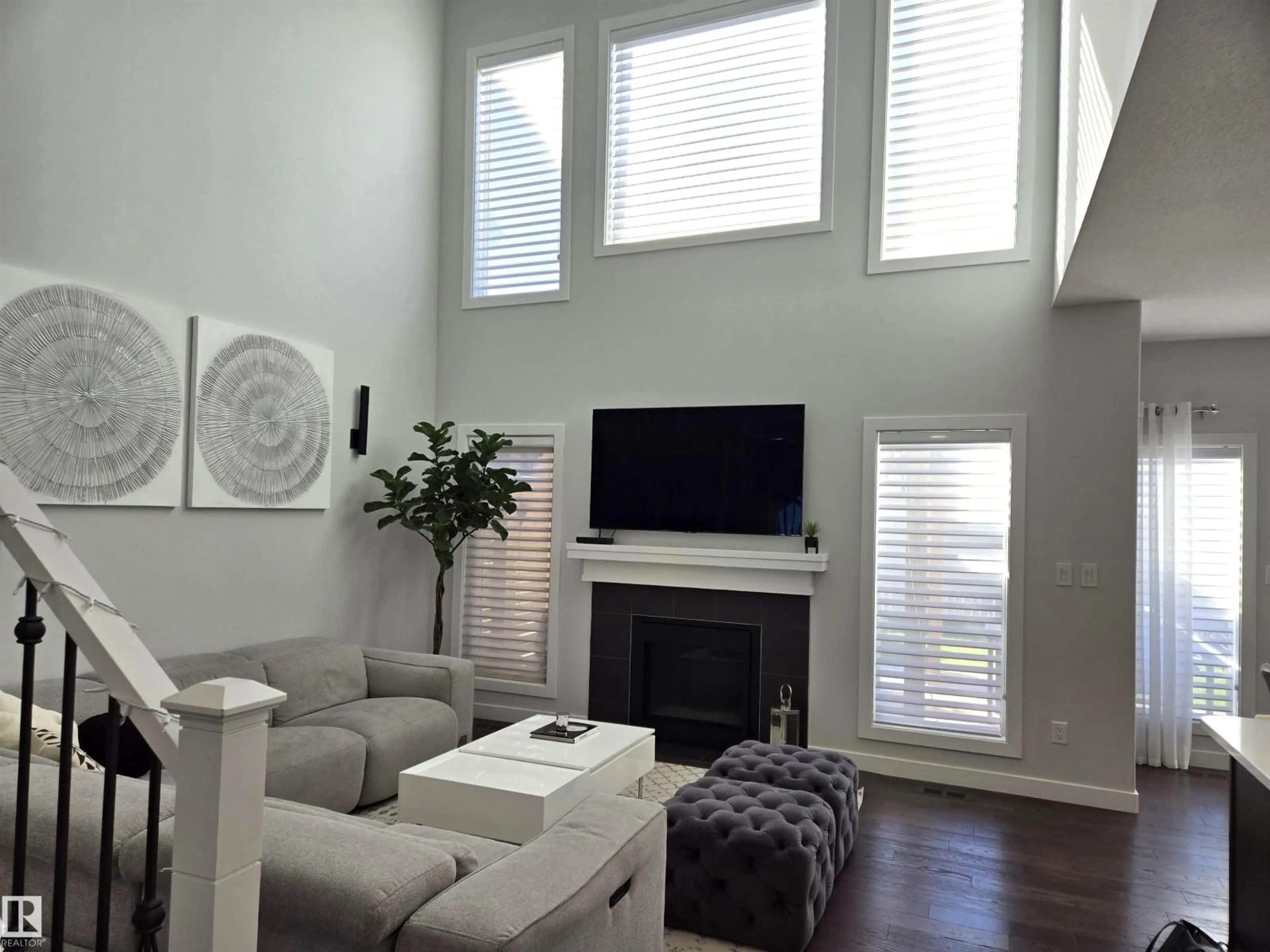 Living room with furniture, wood/laminate floor for SW - 15883 13 AV, Edmonton Alberta T6W2H5