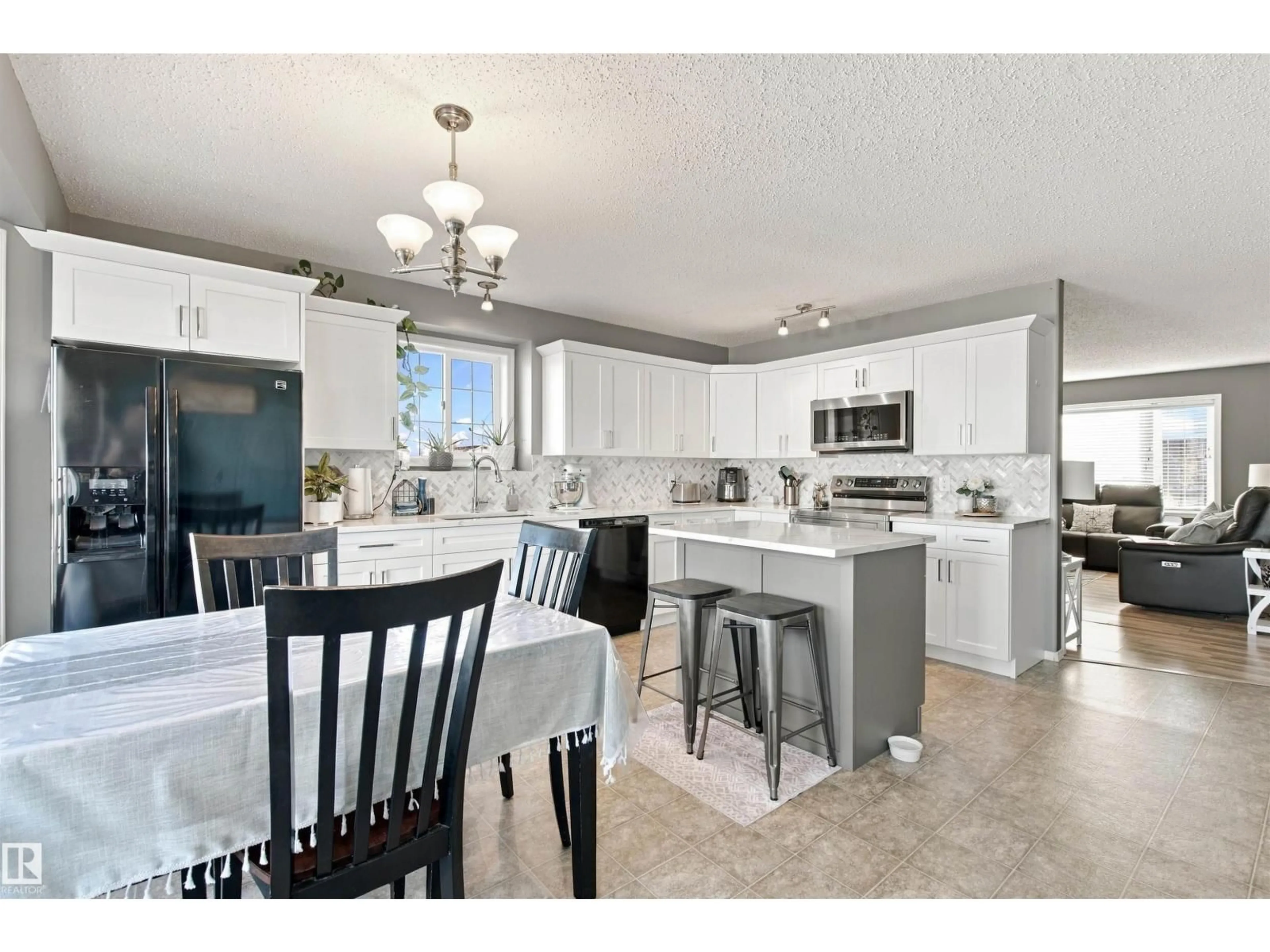 Open concept kitchen, ceramic/tile floor for 3801 42 AVE, Bonnyville Town Alberta T9N2P4