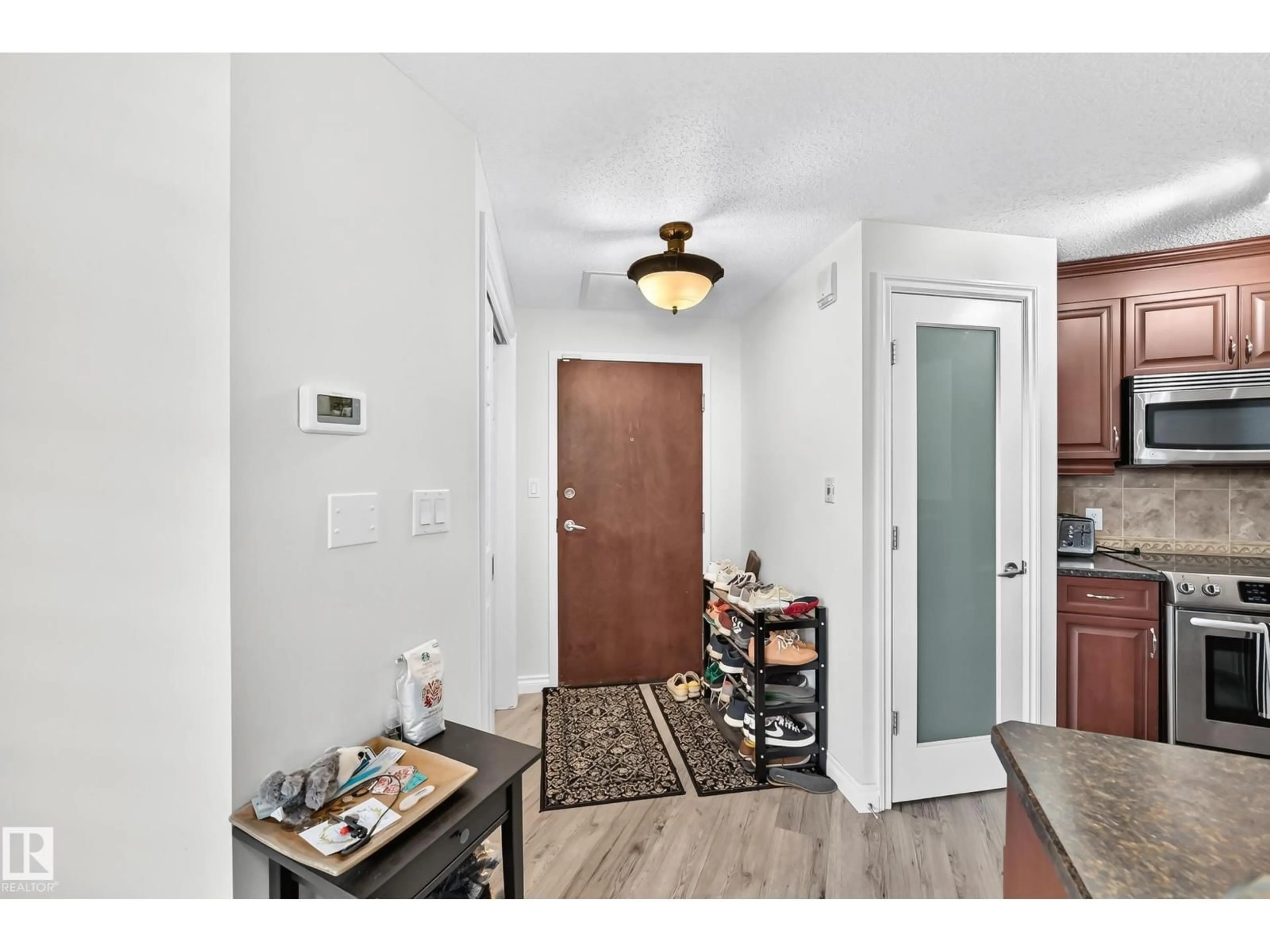 Indoor entryway for #103 - 9020 JASPER AV NW, Edmonton Alberta T5H3S8