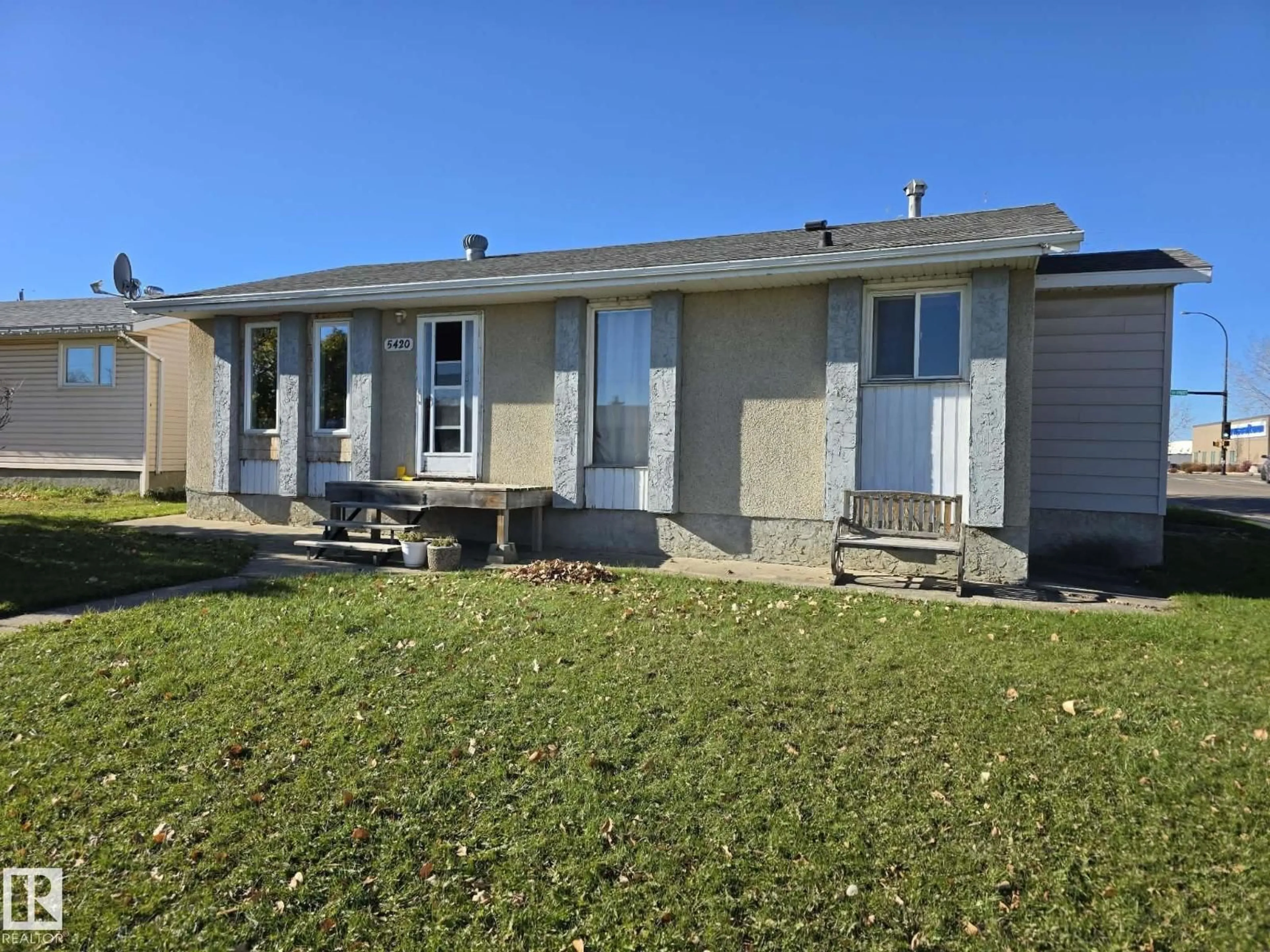 Home with vinyl exterior material, street for 5420 49B ST, Drayton Valley Alberta T7A1C4