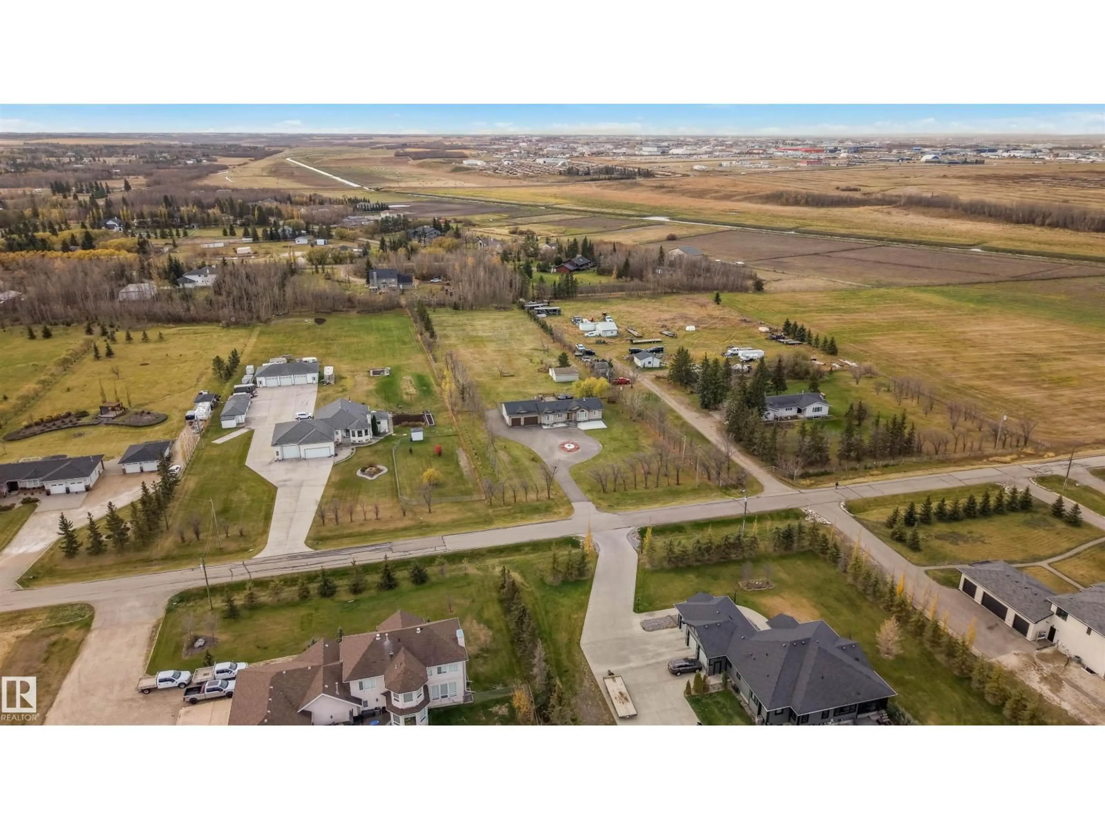 A pic from outside/outdoor area/front of a property/back of a property/a pic from drone, street for 55 50452 RGE RD, Rural Leduc County Alberta T4X0P5