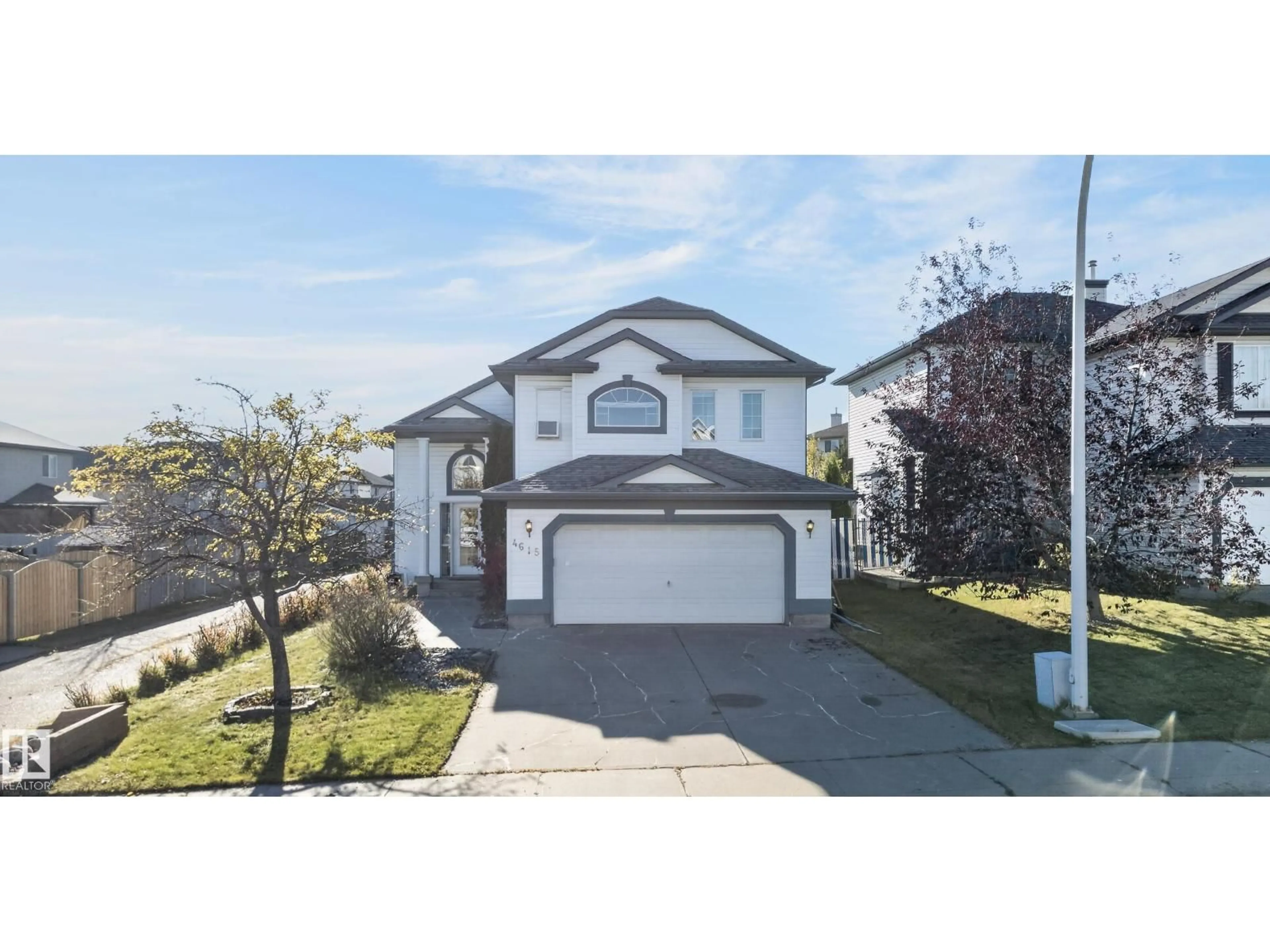 Home with vinyl exterior material, street for NW - 4615 151 AV, Edmonton Alberta T5Y3A1