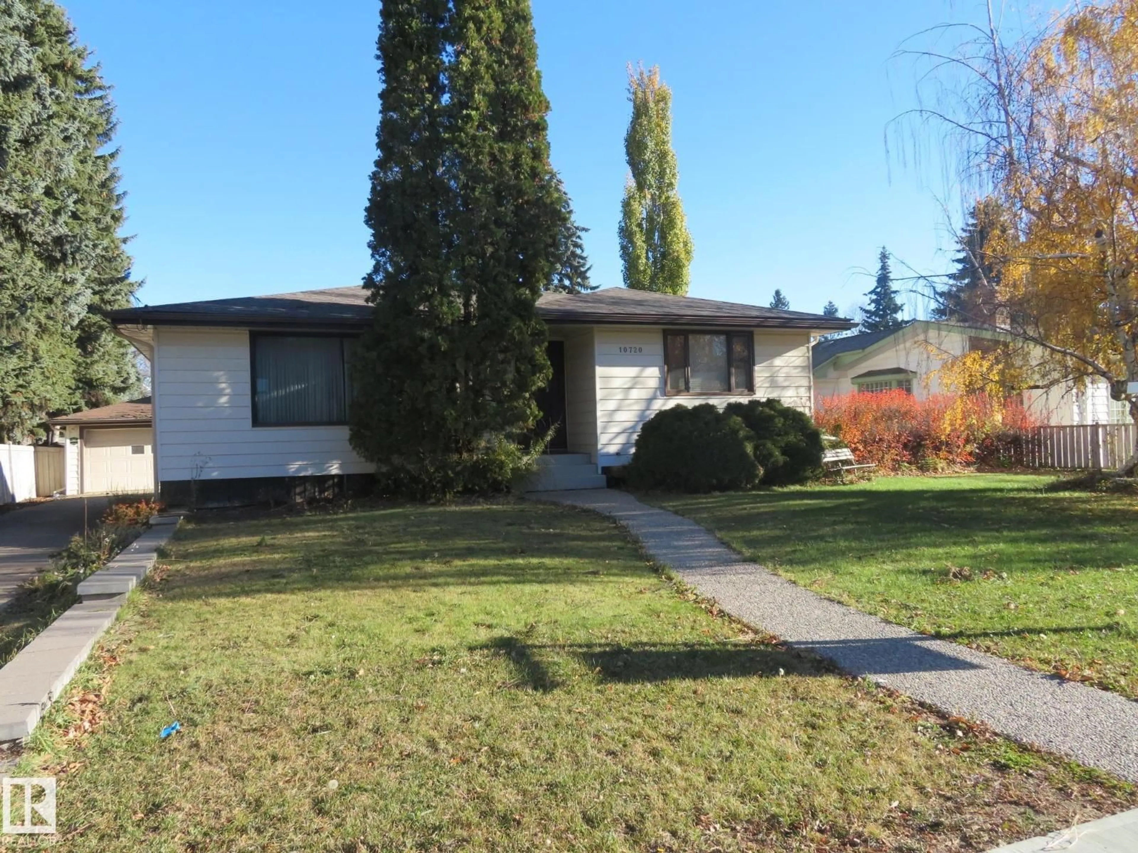 Home with vinyl exterior material, street for 10720 57 AV, Edmonton Alberta T6H0Y6