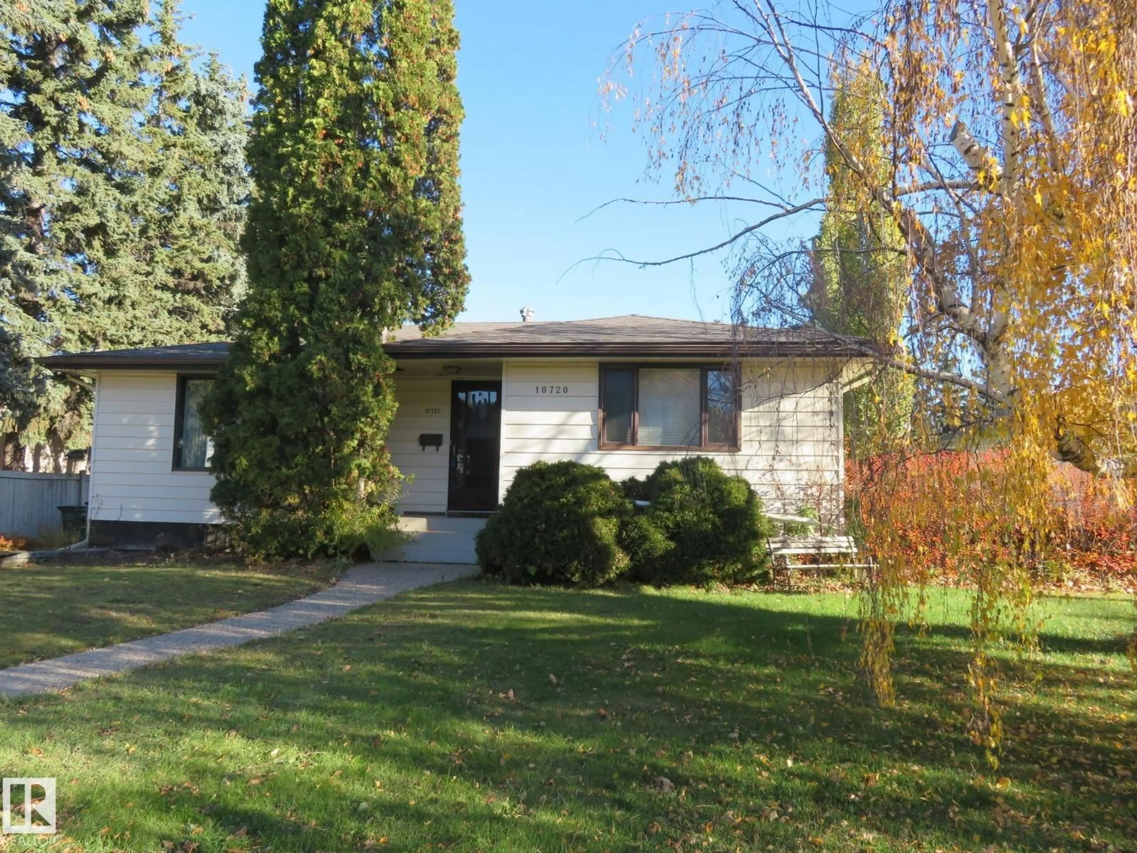 Home with vinyl exterior material, street for 10720 57 AV, Edmonton Alberta T6H0Y6