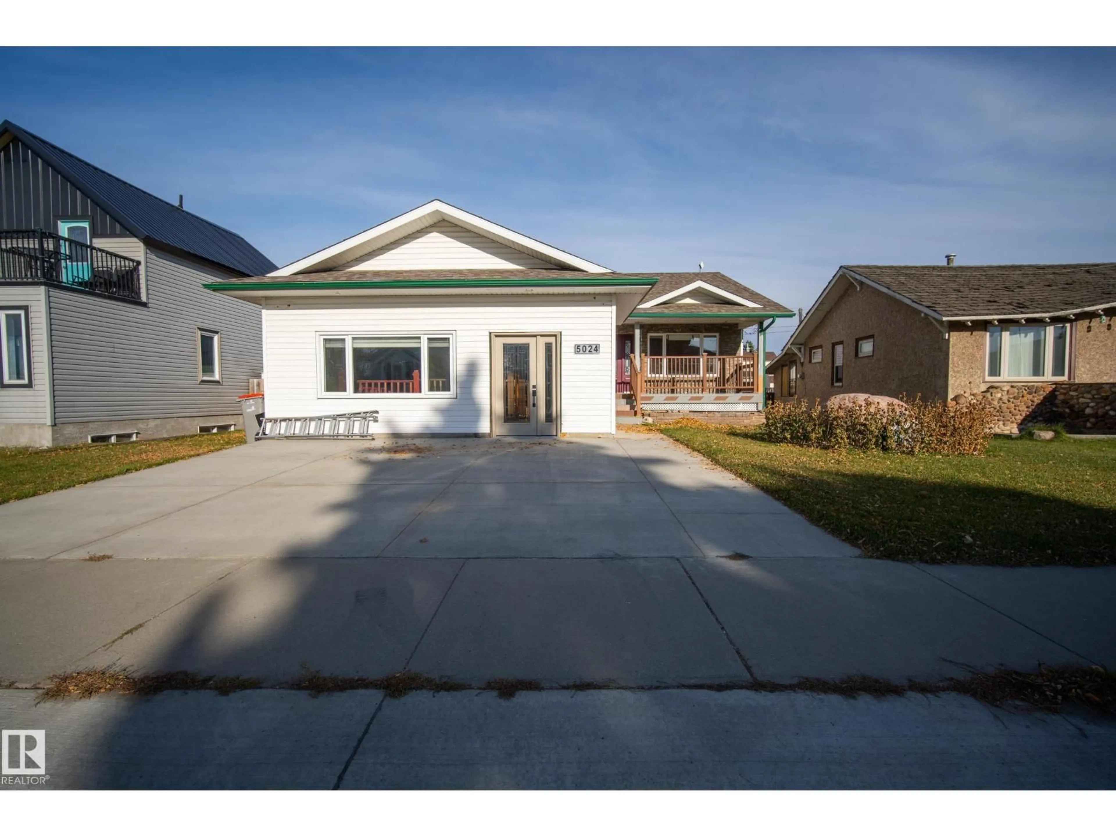Home with vinyl exterior material, street for 5024 50 AV, Millet Alberta T0C1Z0