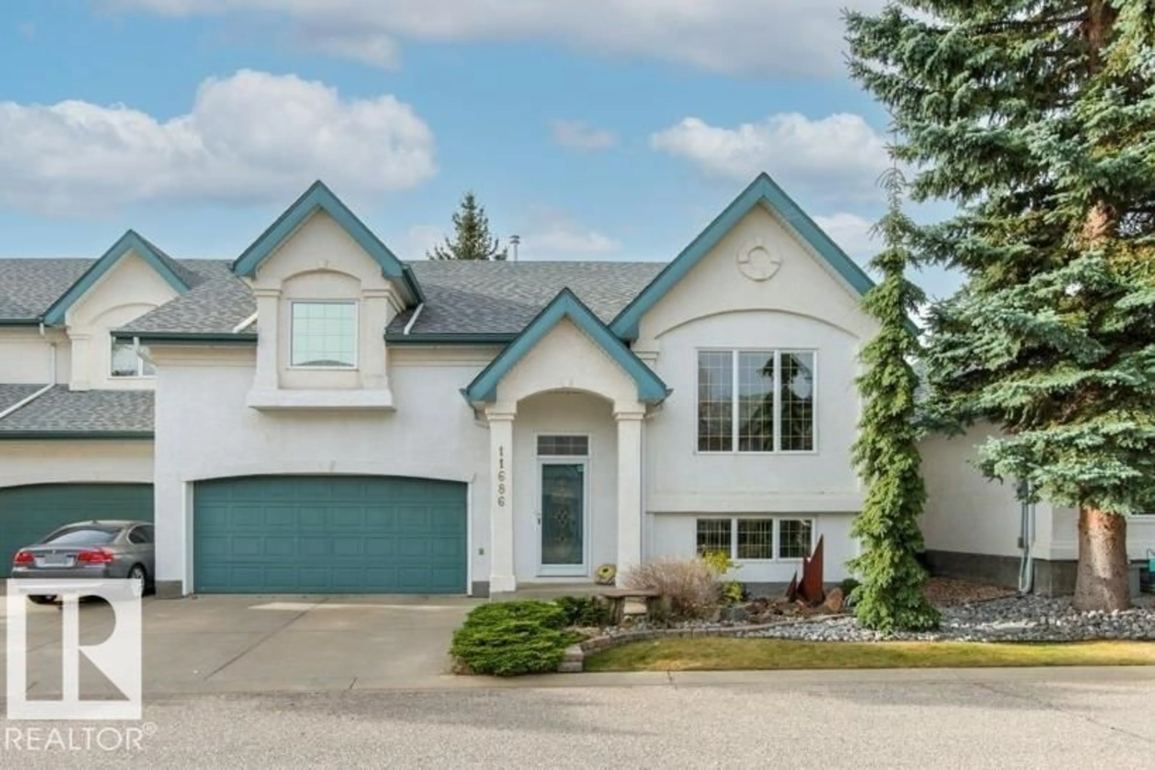 Home with vinyl exterior material, street for 11686 15 AV, Edmonton Alberta T6J7E1