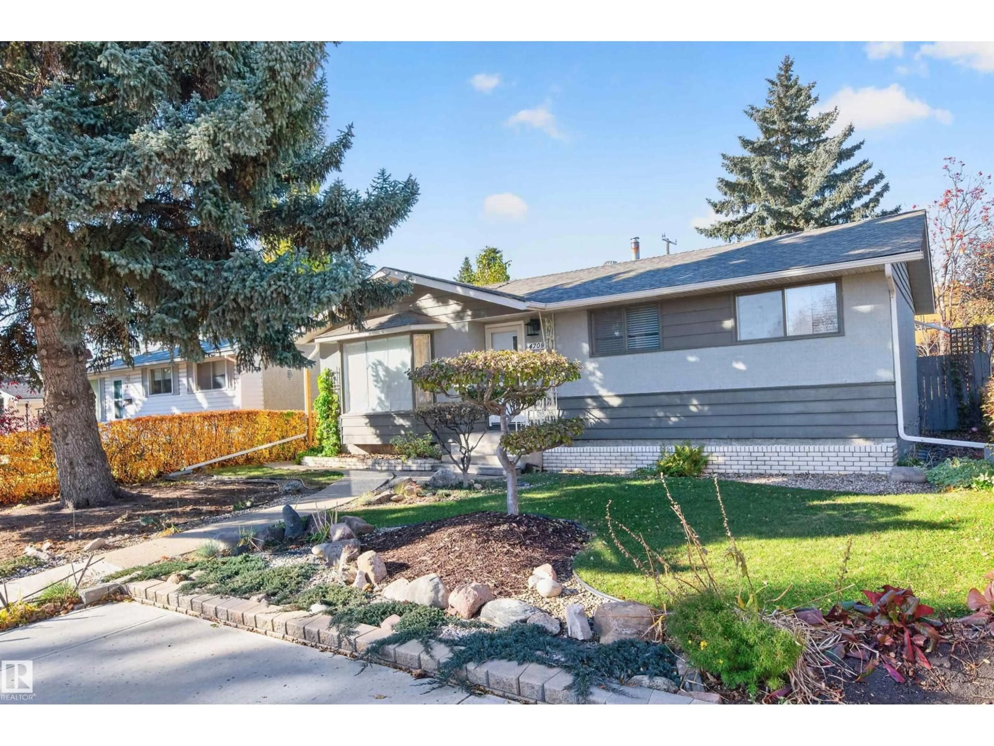 Home with vinyl exterior material, street for 4708 MALMO RD, Edmonton Alberta T6H4L6