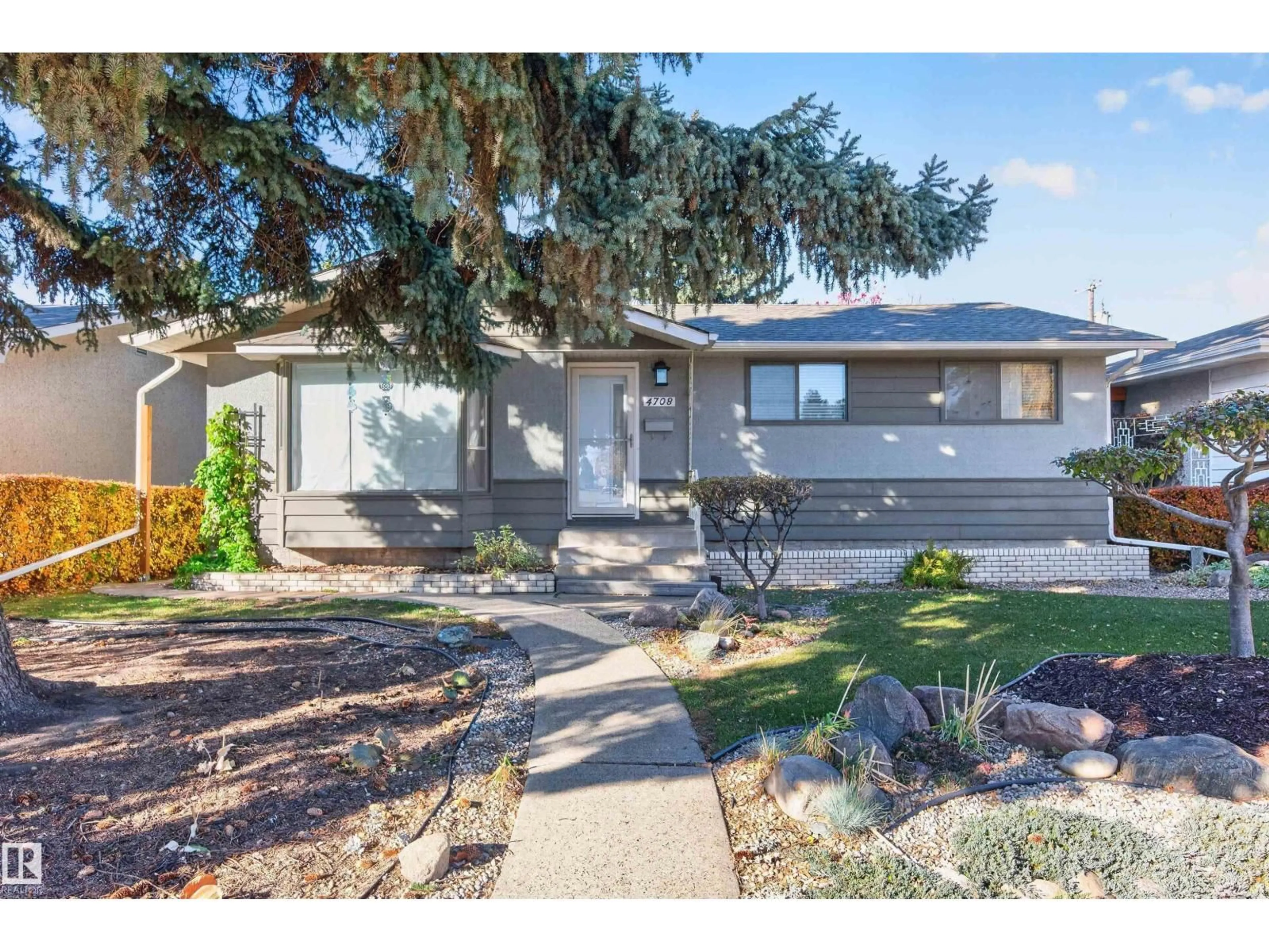 Home with vinyl exterior material, street for 4708 MALMO RD, Edmonton Alberta T6H4L6