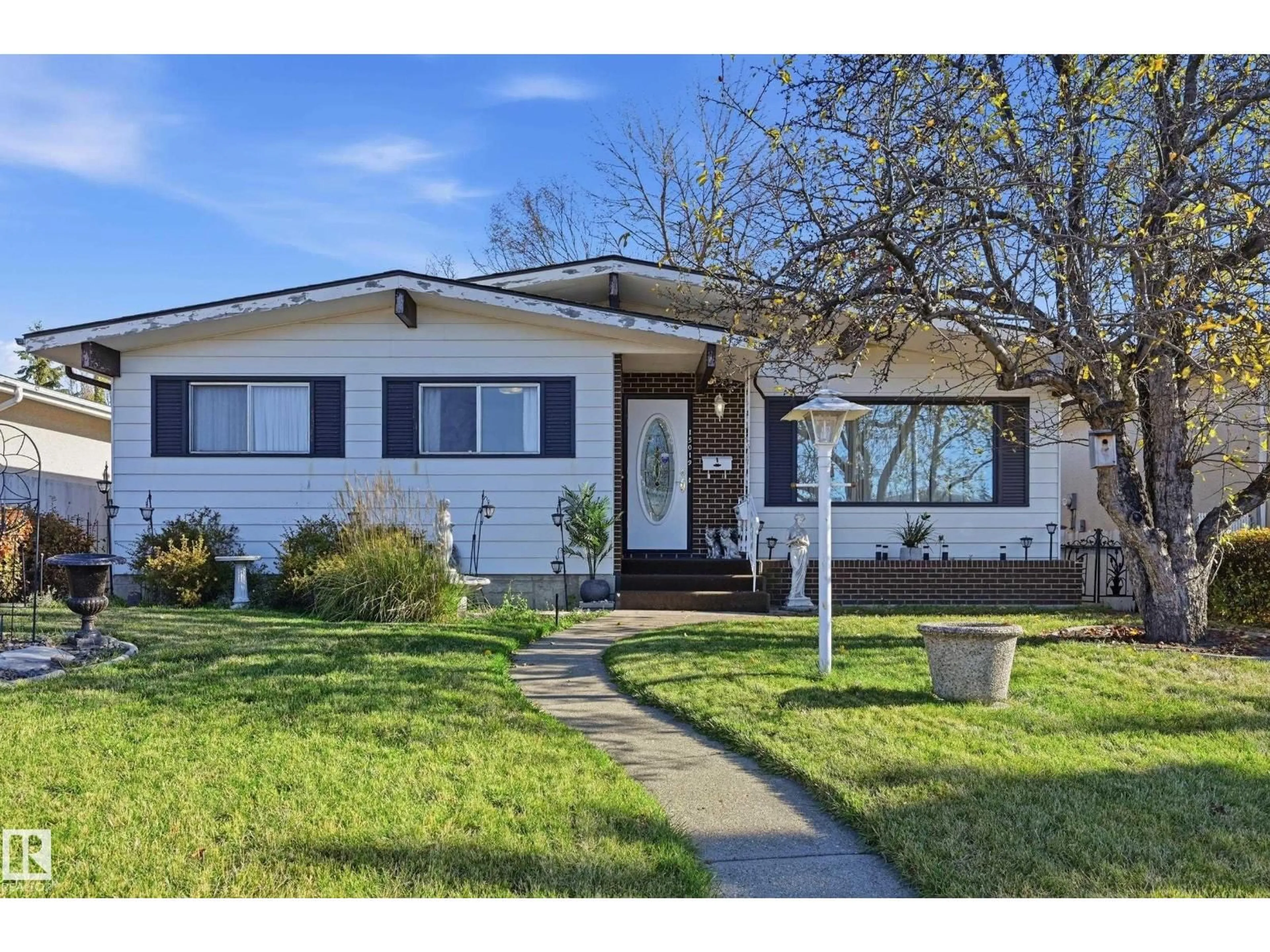 Home with vinyl exterior material, street for 15019 84 ST, Edmonton Alberta T5E5X3