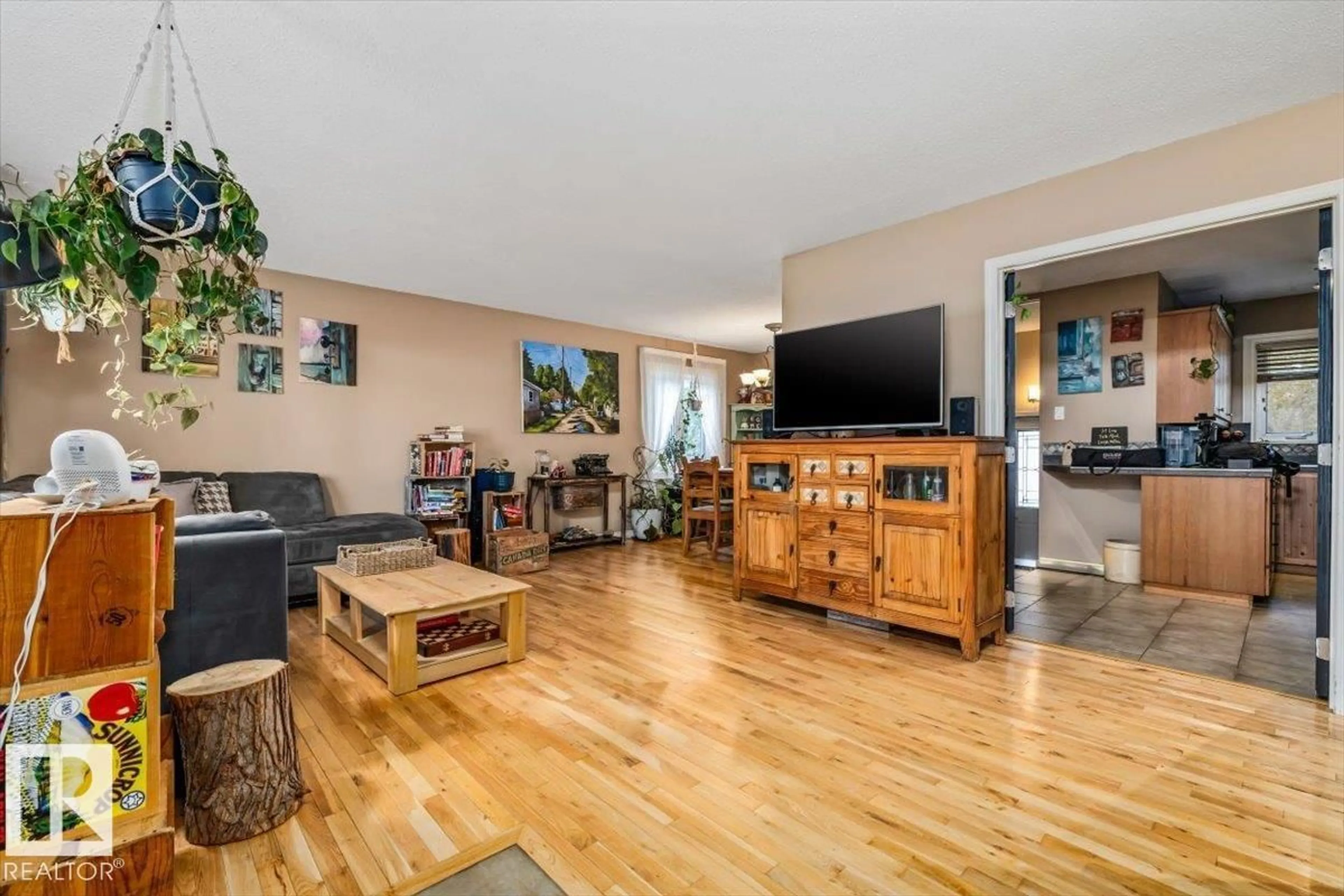Living room with furniture, wood/laminate floor for 9212 93 ST, Fort Saskatchewan Alberta T0M2C0